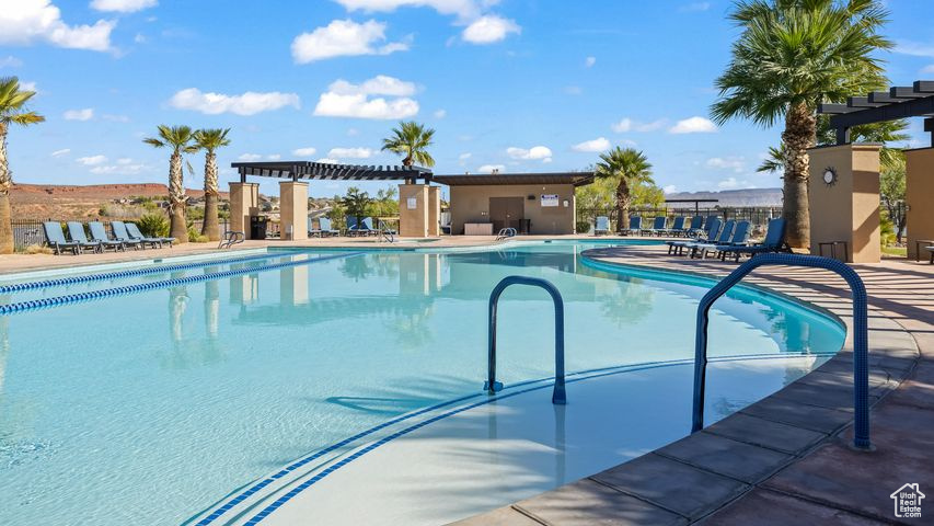 View of pool featuring a pergola and a patio area