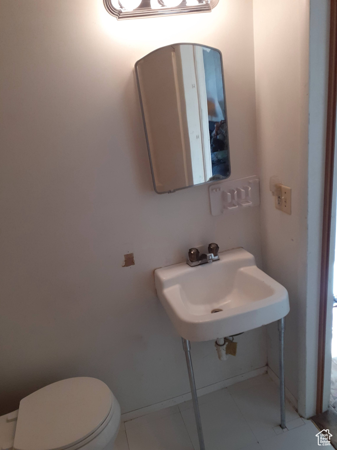 Bathroom featuring toilet and sink
