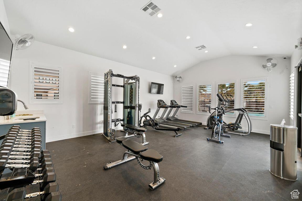 Gym featuring lofted ceiling