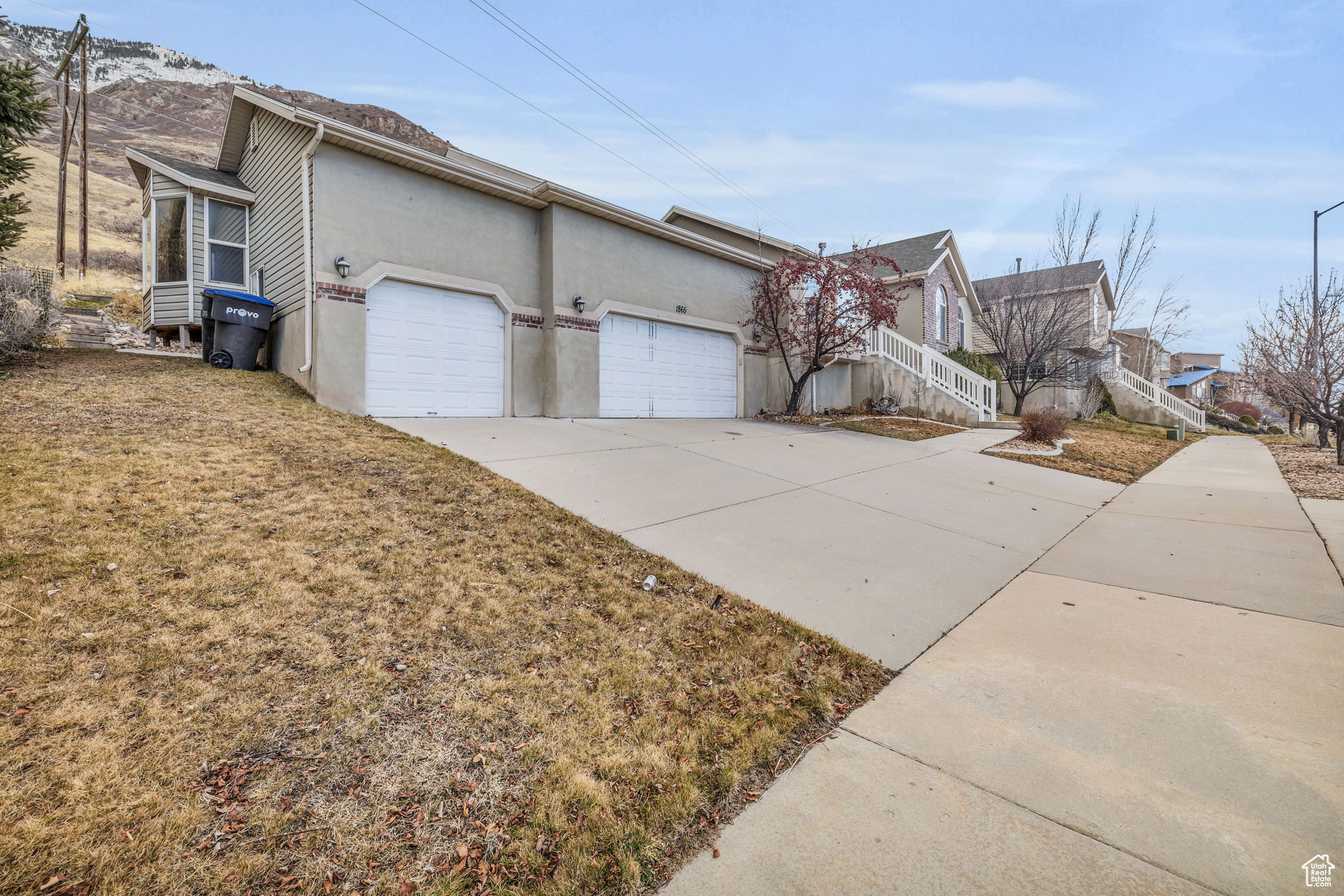 View of property exterior featuring a garage