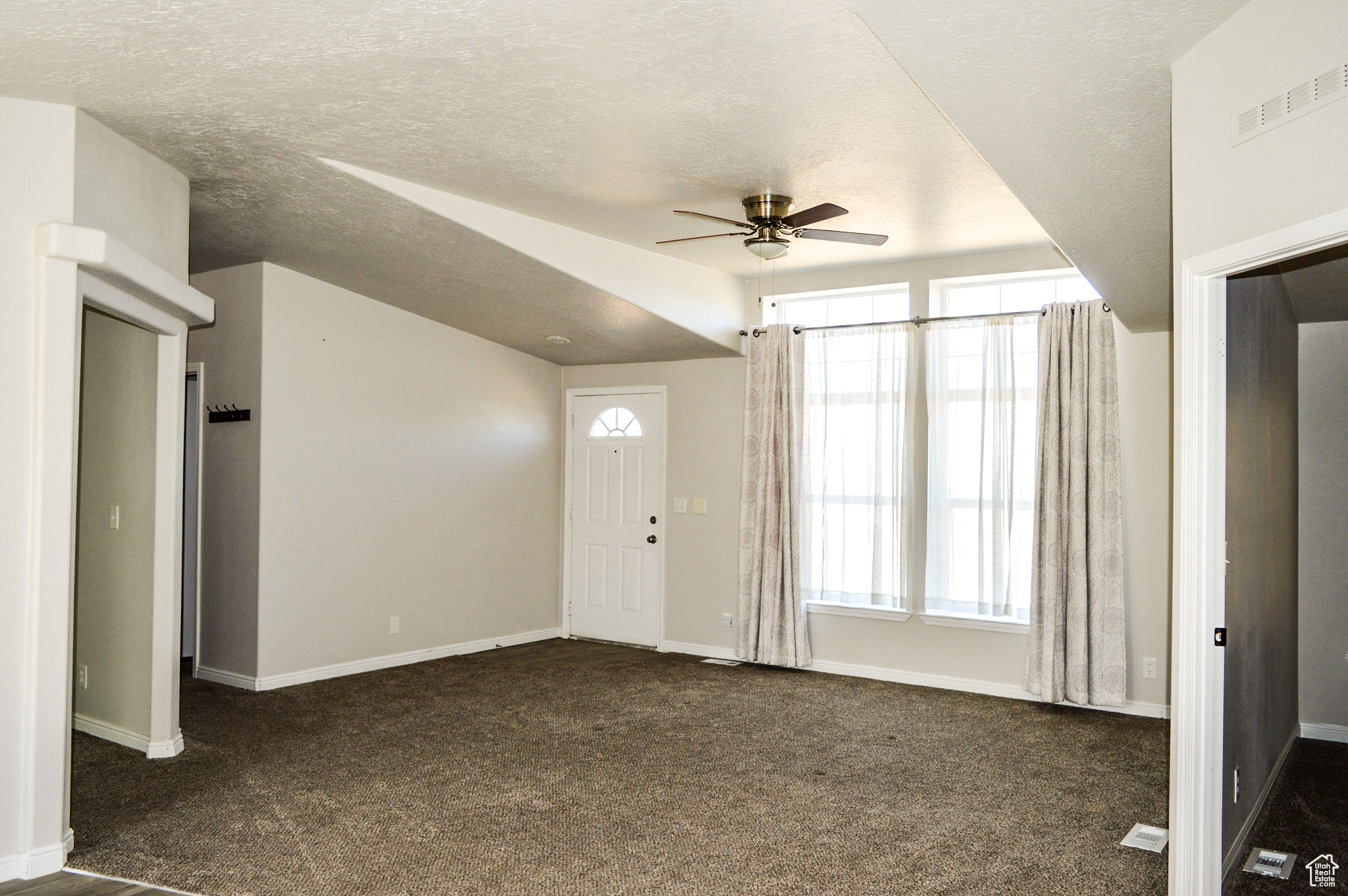 Front entry with vaulted ceilings.