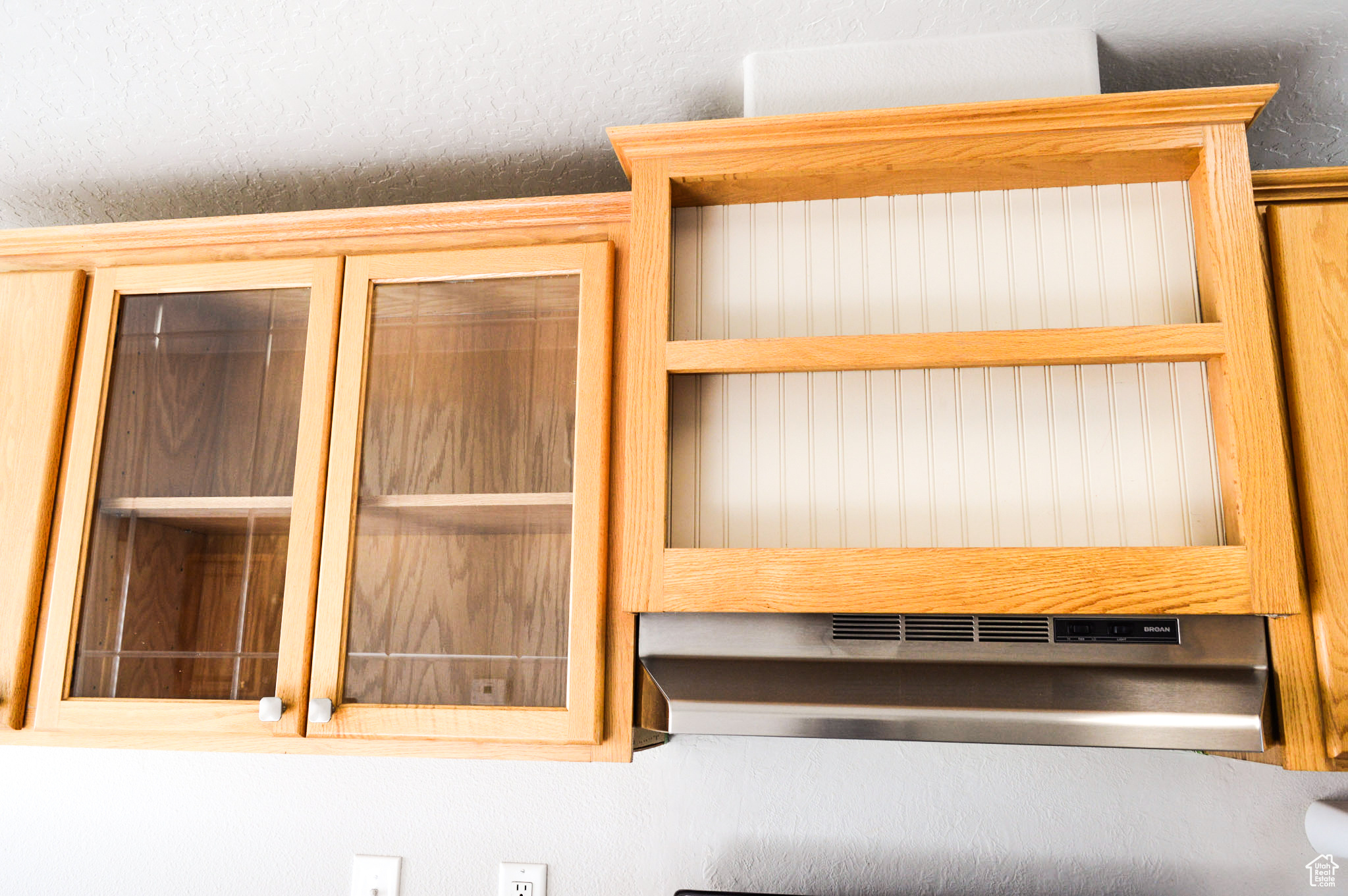 Above and beside range cabinetry