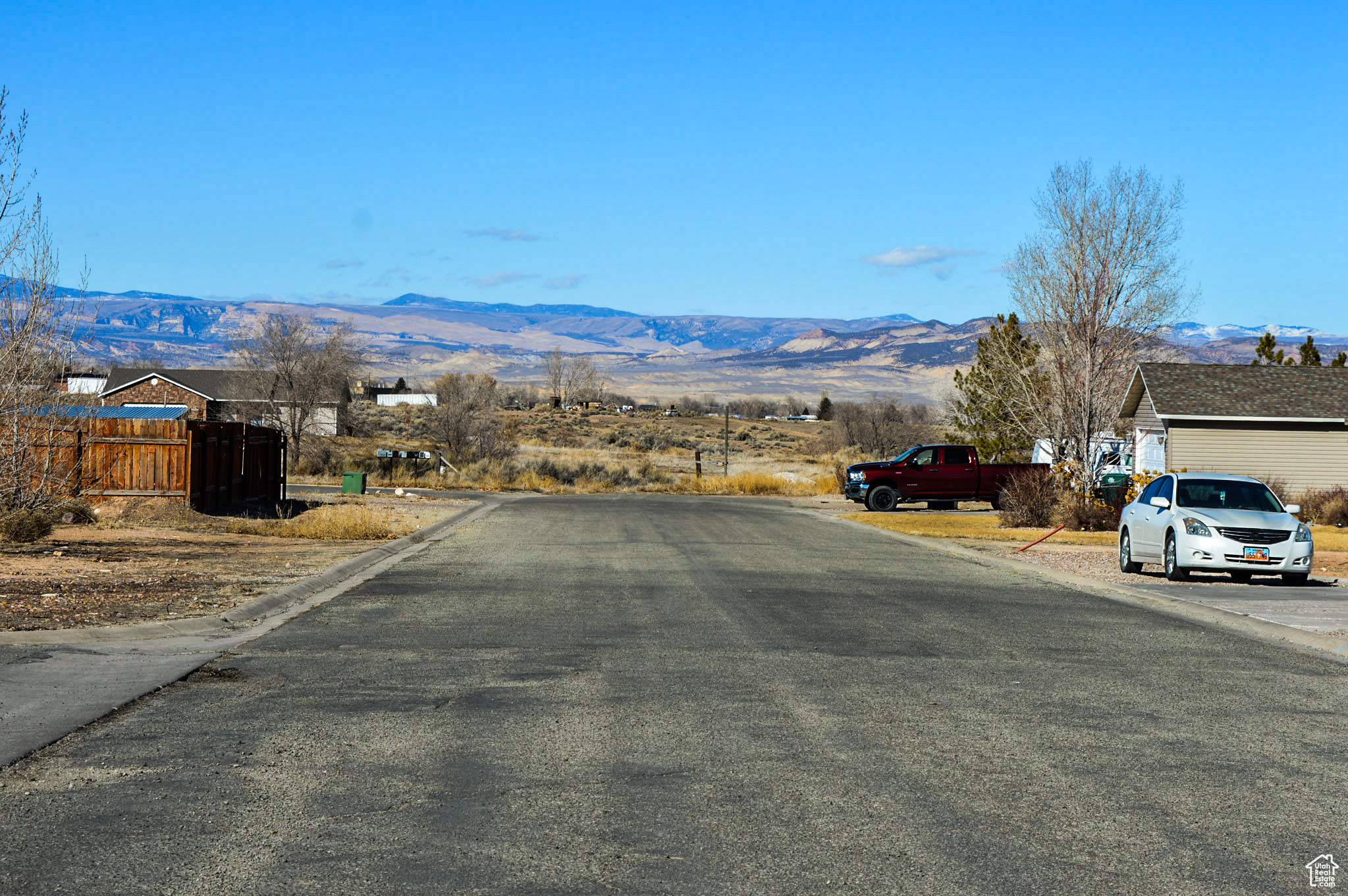 View of street with a mountain view from another side of home.