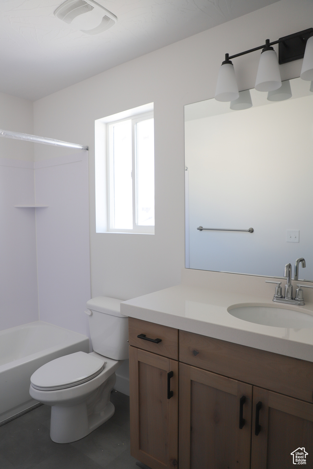 Full bathroom with vanity, toilet, and washtub / shower combination