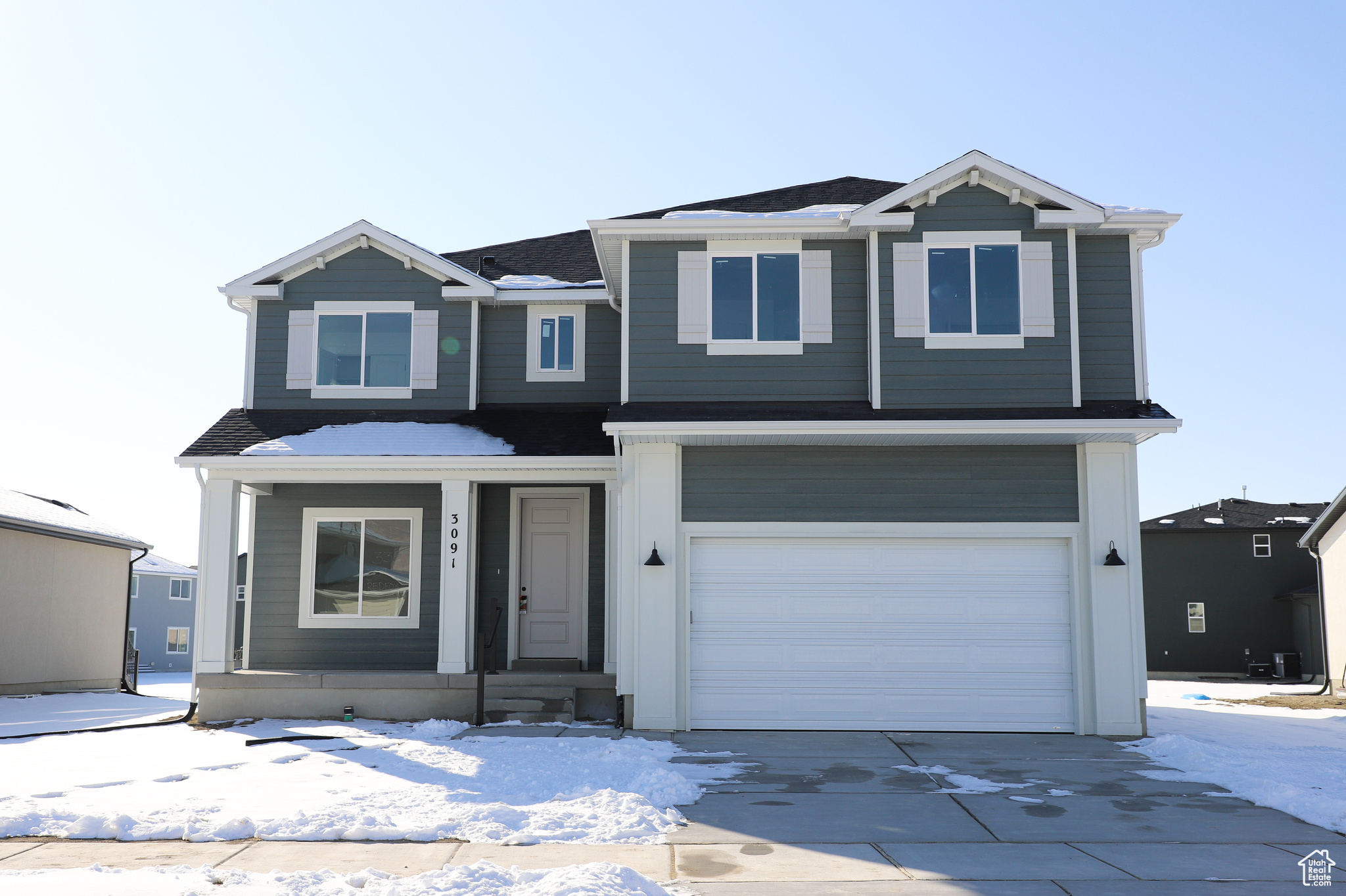 View of front of property with a garage