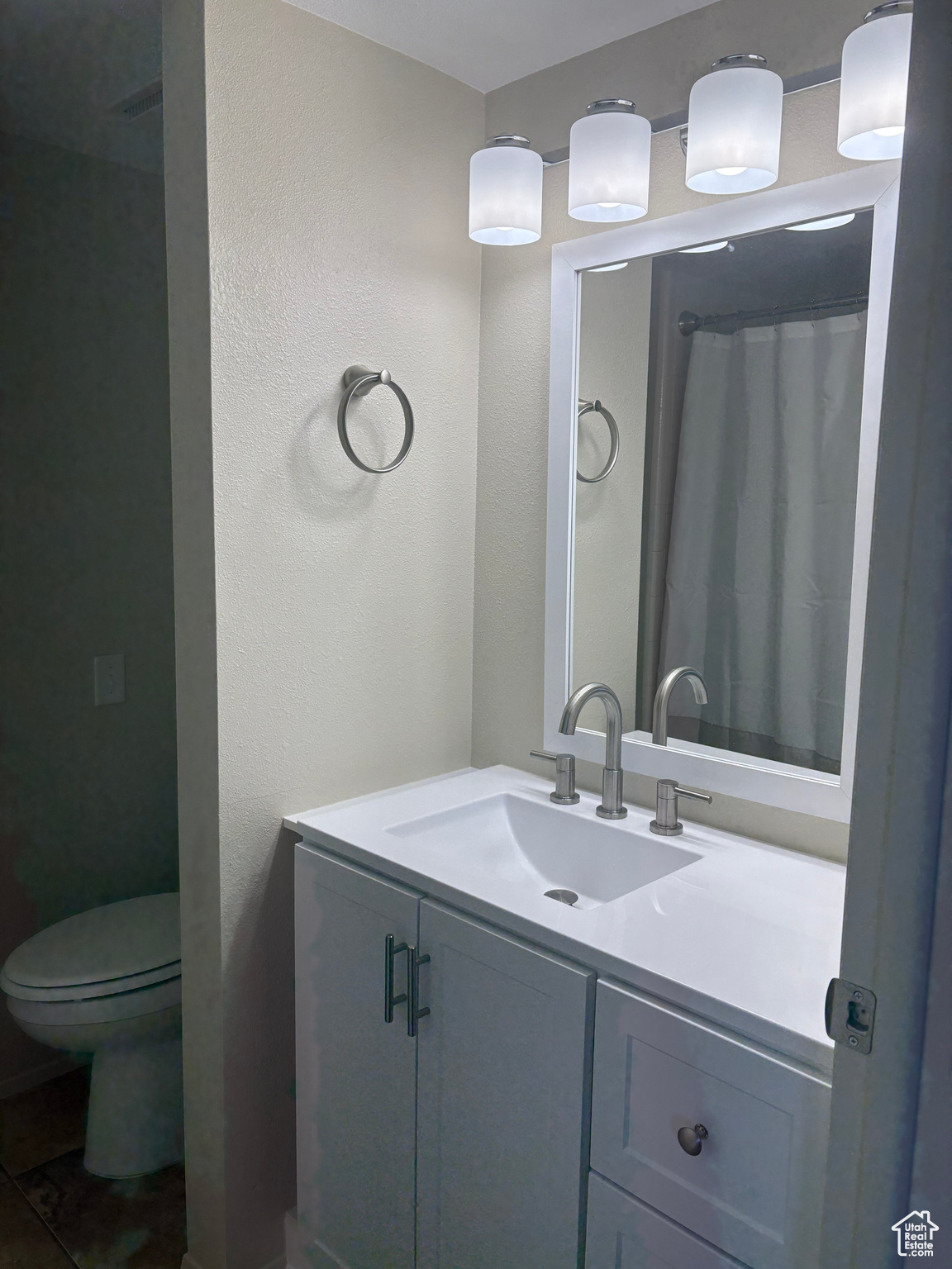 Bathroom with vanity and toilet