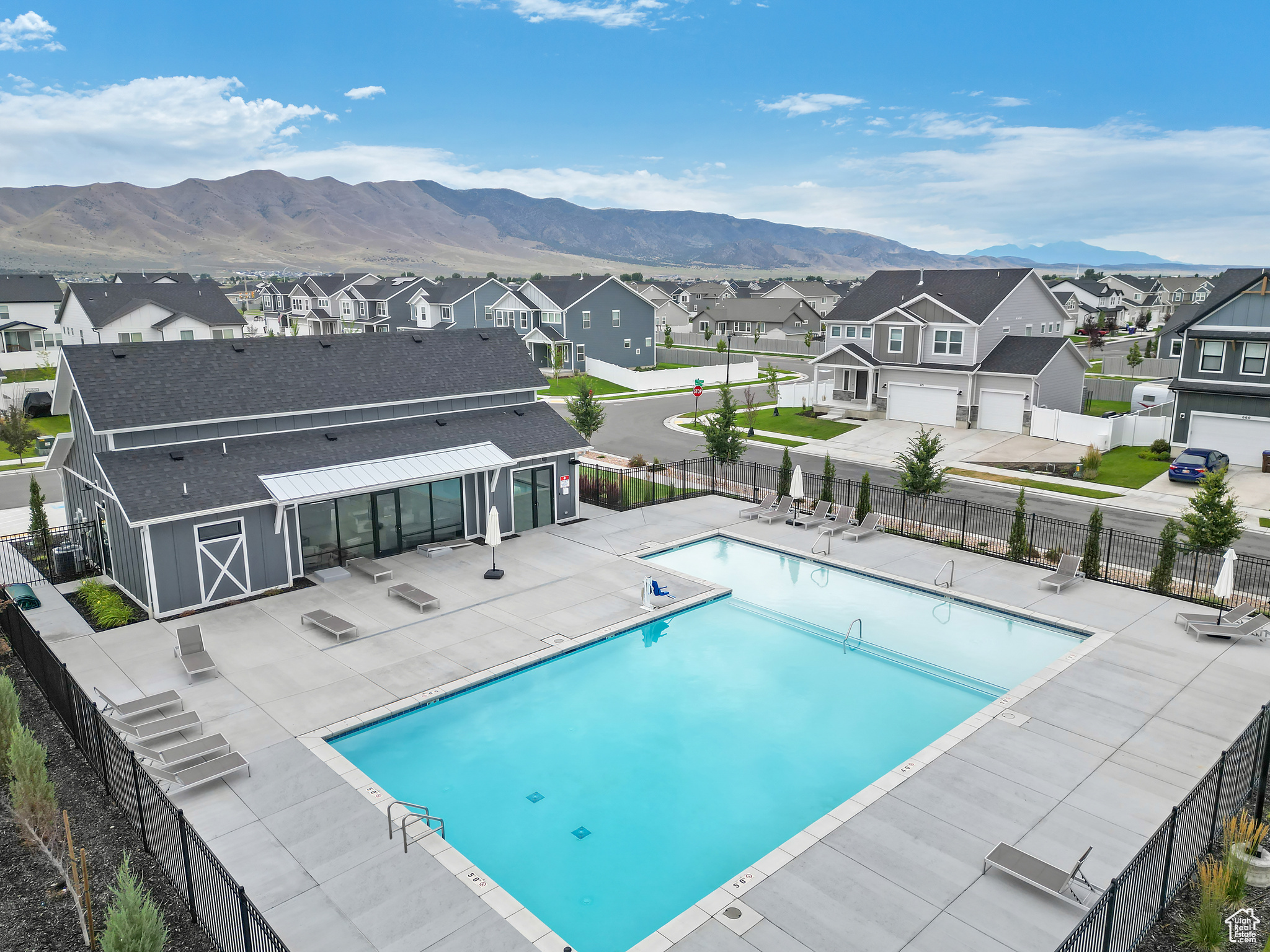 View of pool with a mountain view and a patio area