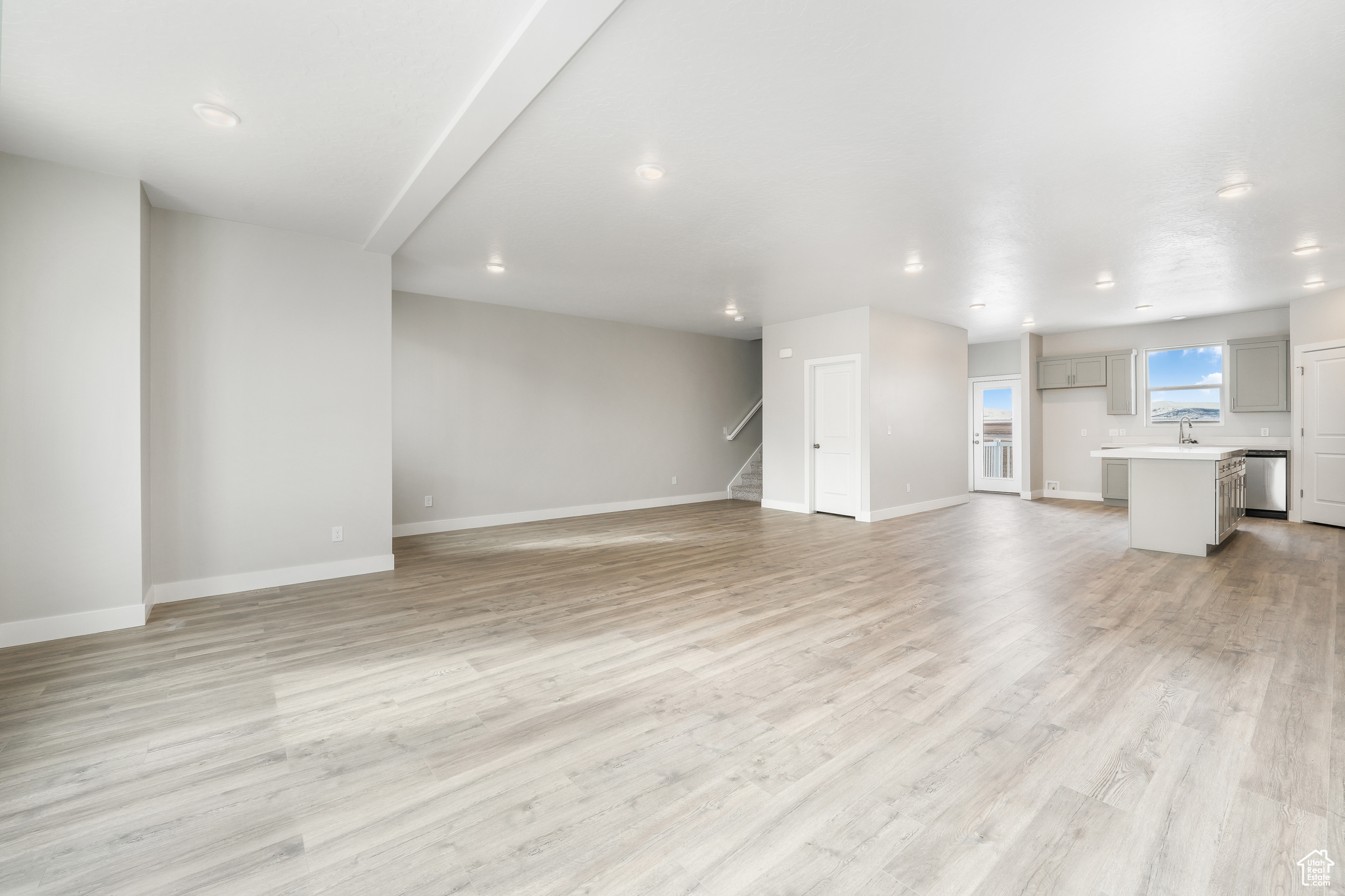 Unfurnished living room with light hardwood / wood-style flooring