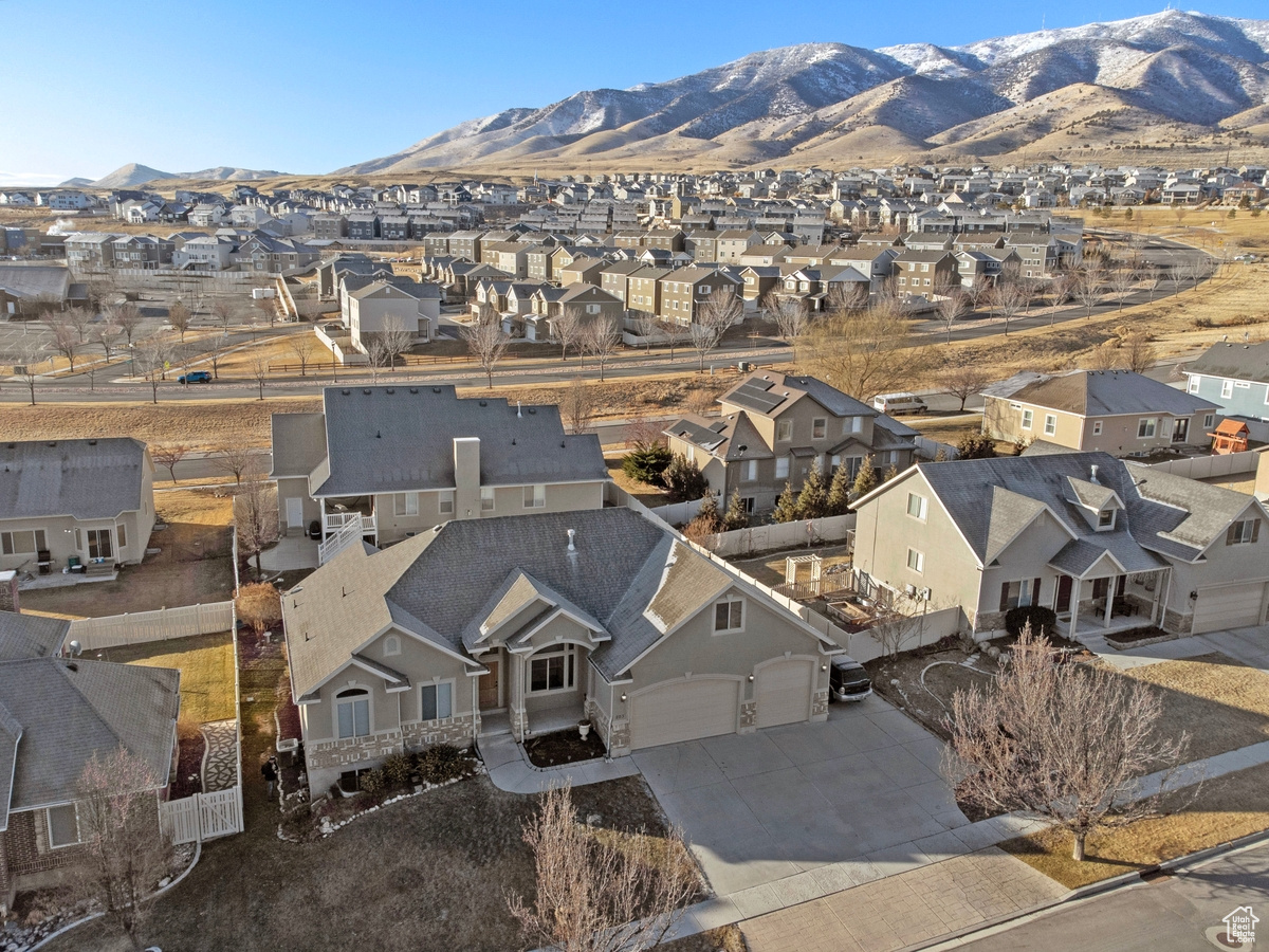 Birds eye view of property with a mountain view
