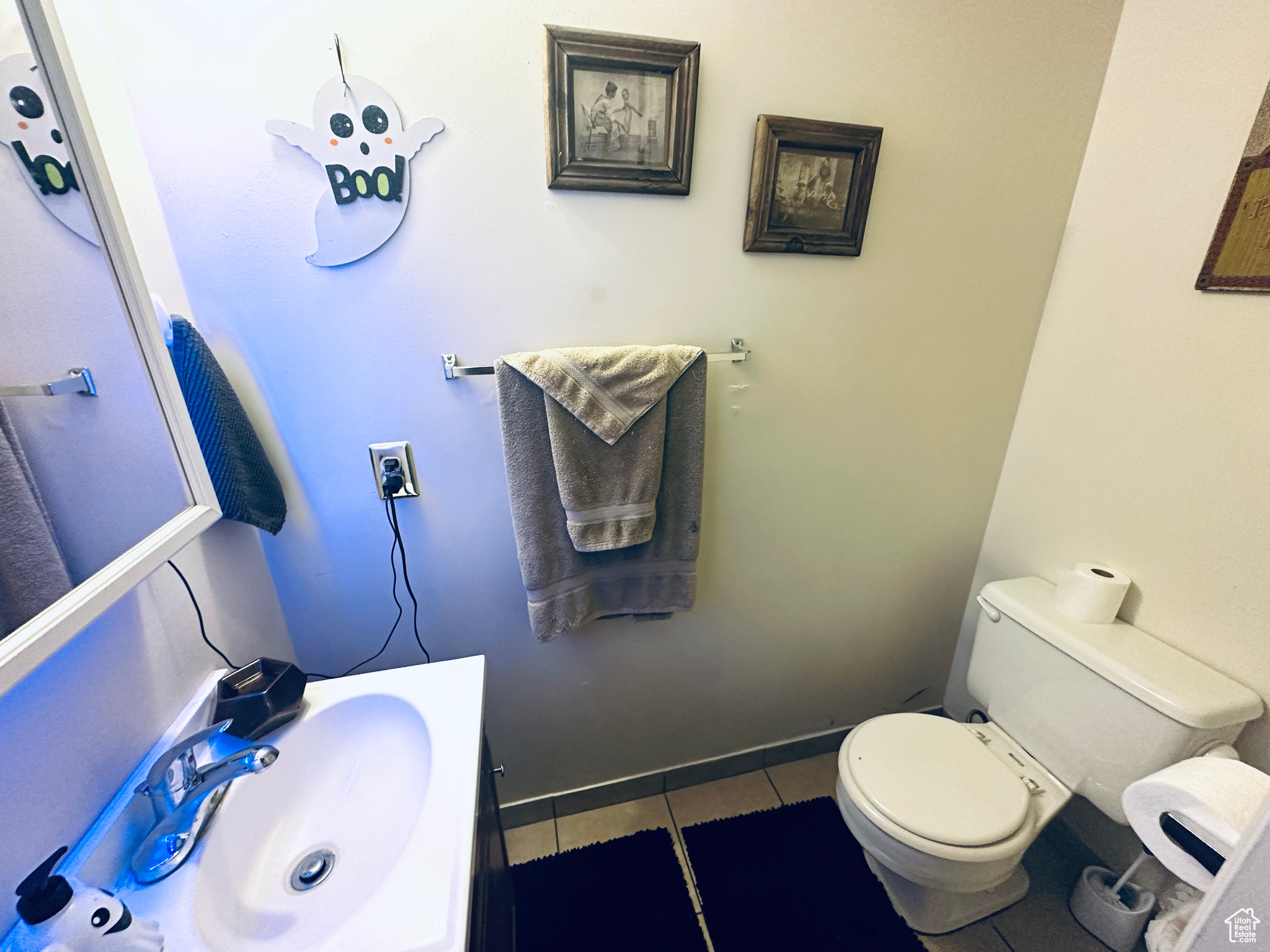 Bathroom with tile patterned flooring, vanity, and toilet