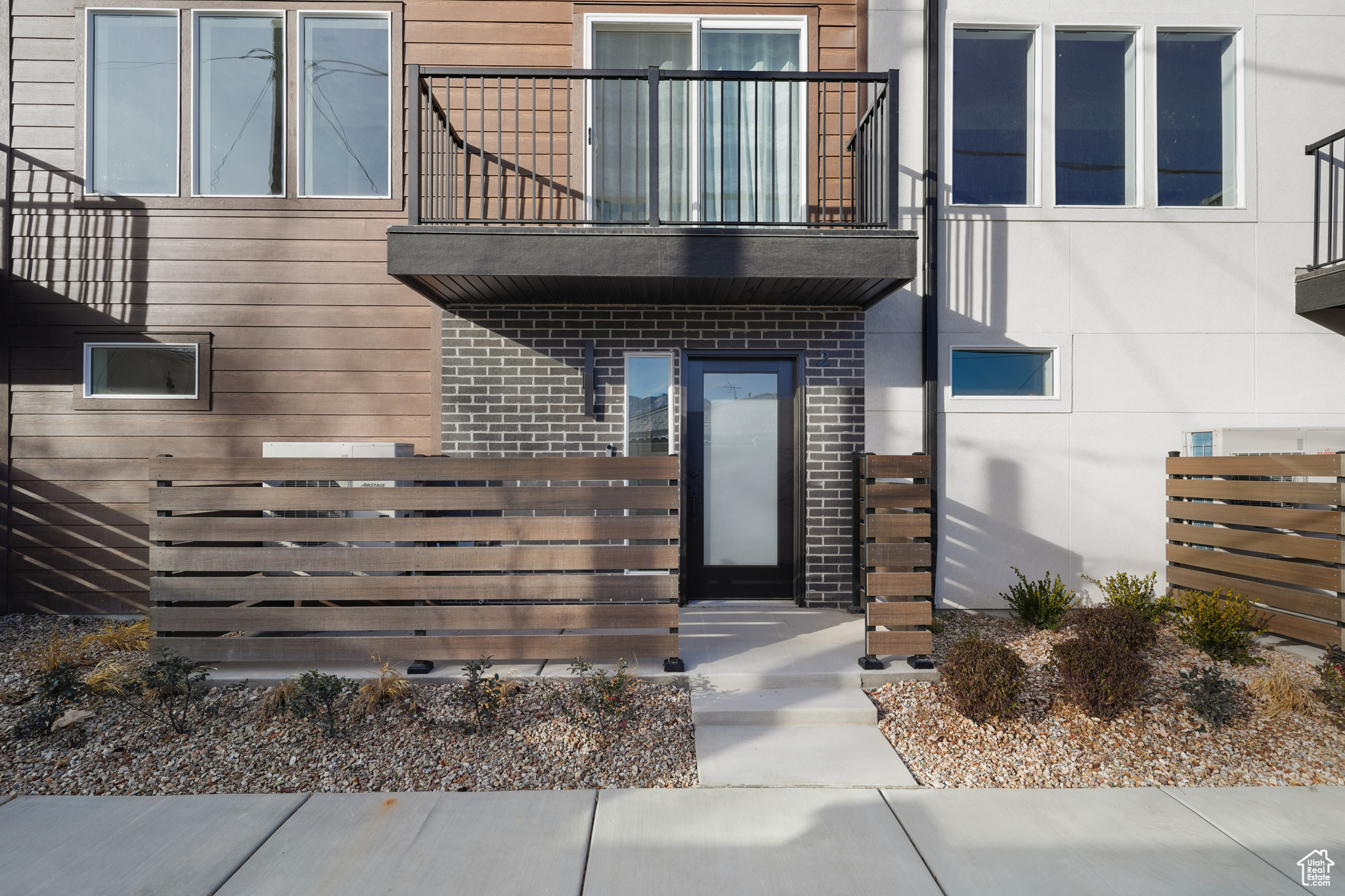 Entrance to property with a balcony