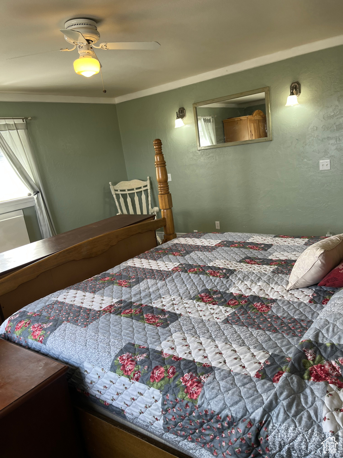 Bedroom featuring crown molding and ceiling fan