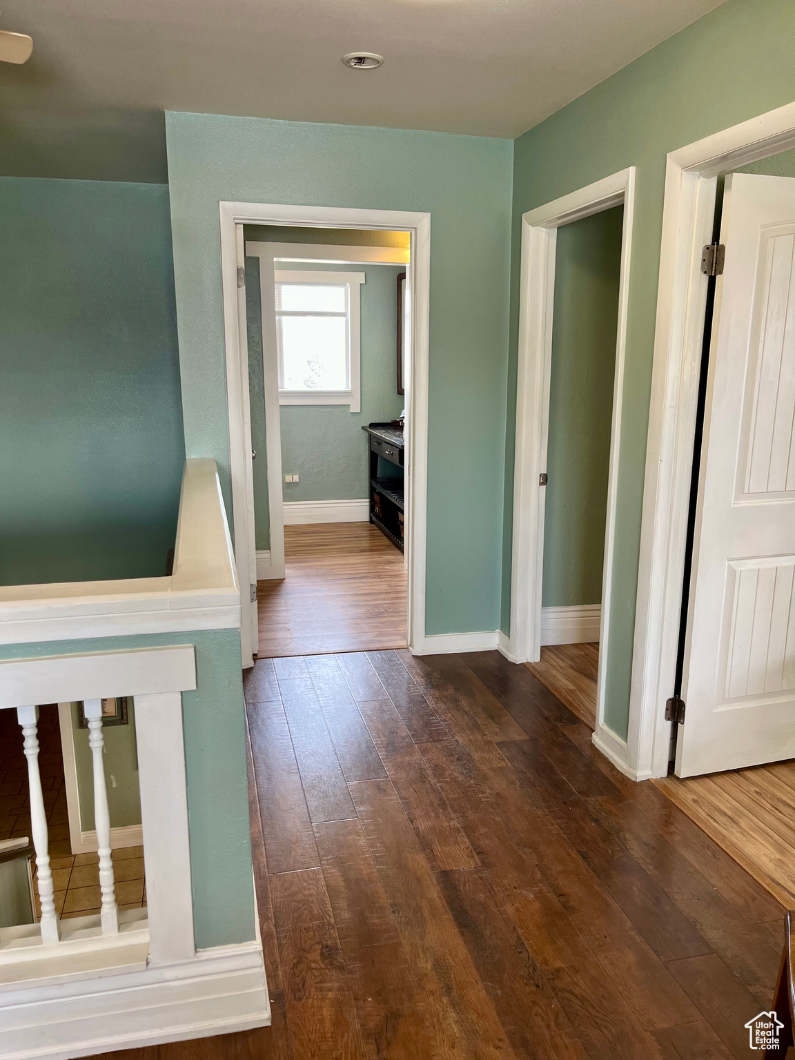 Hallway featuring dark hardwood / wood-style floors