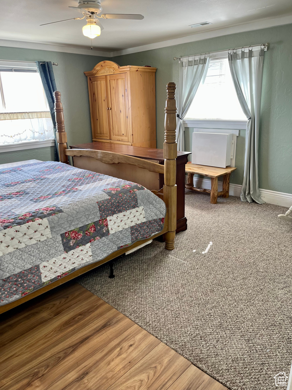 Bedroom with crown molding and ceiling fan