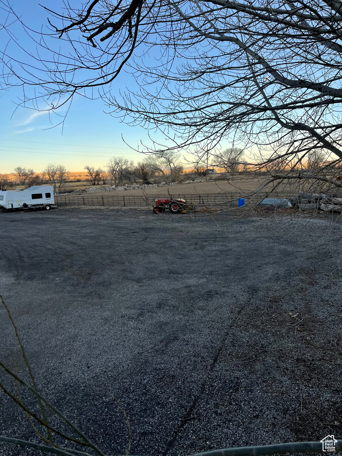 Yard at dusk featuring a rural view