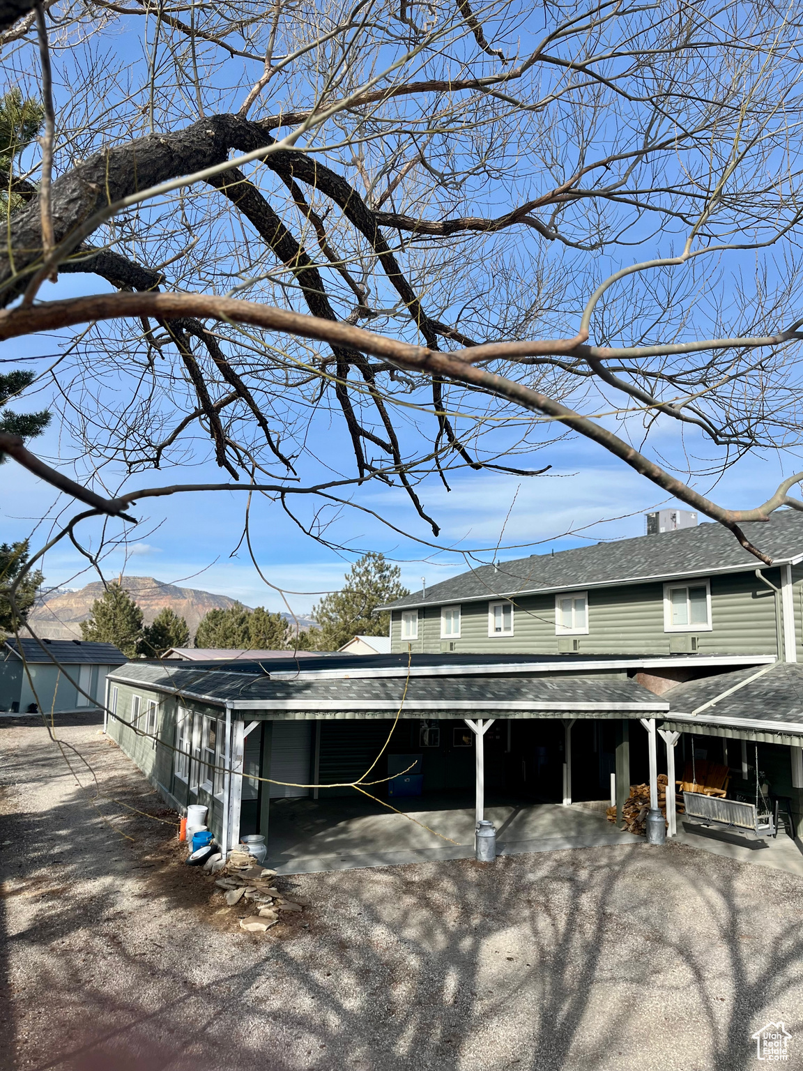 Exterior space featuring a mountain view and a carport