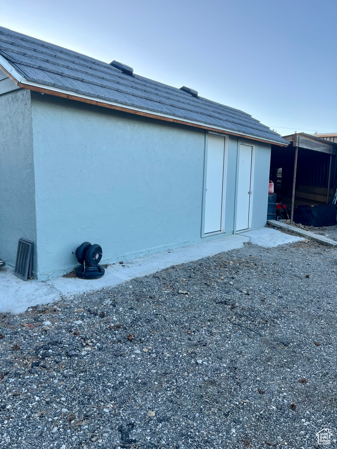 View of home's exterior with an outdoor structure