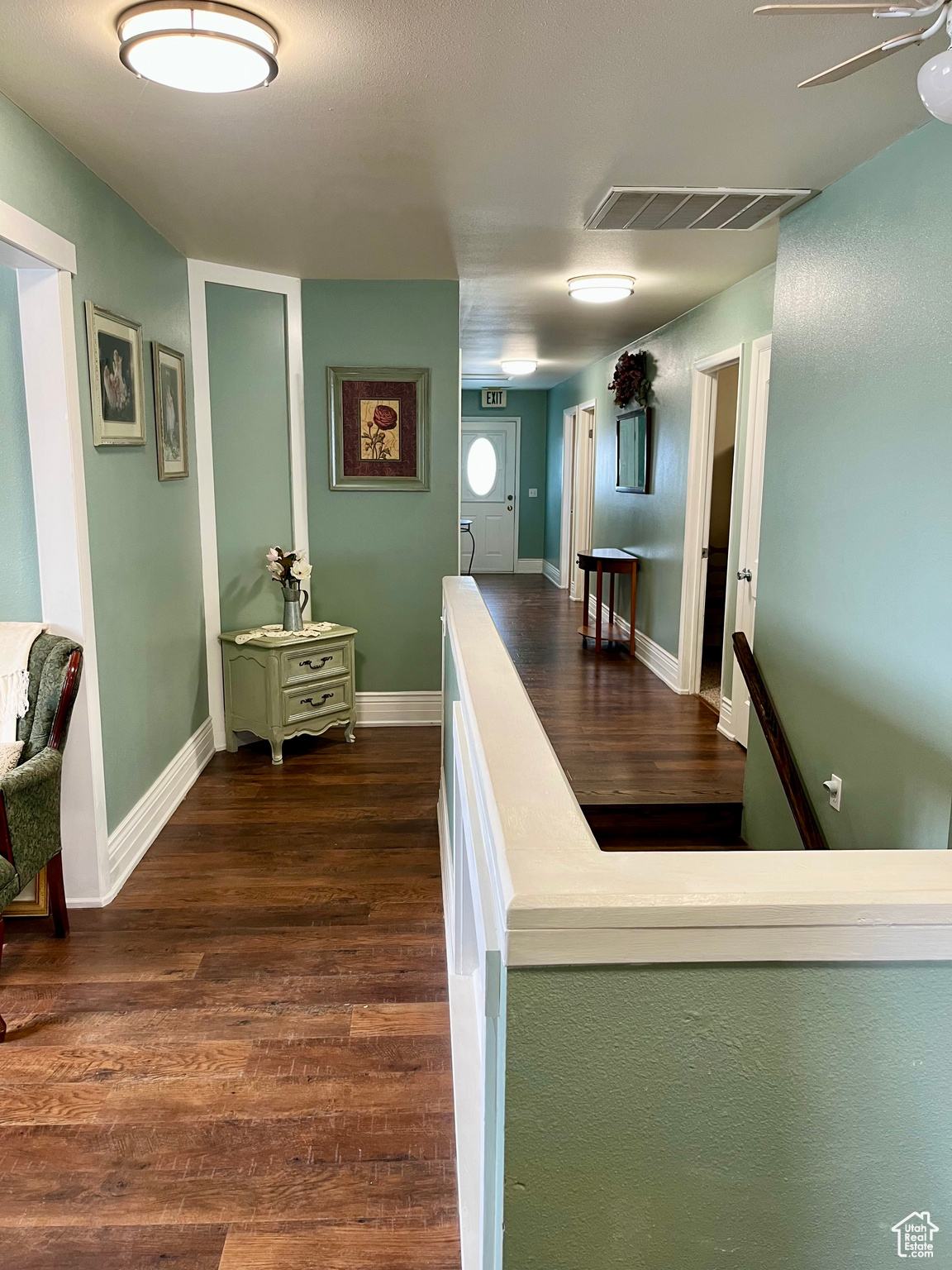 Hallway featuring dark hardwood / wood-style flooring