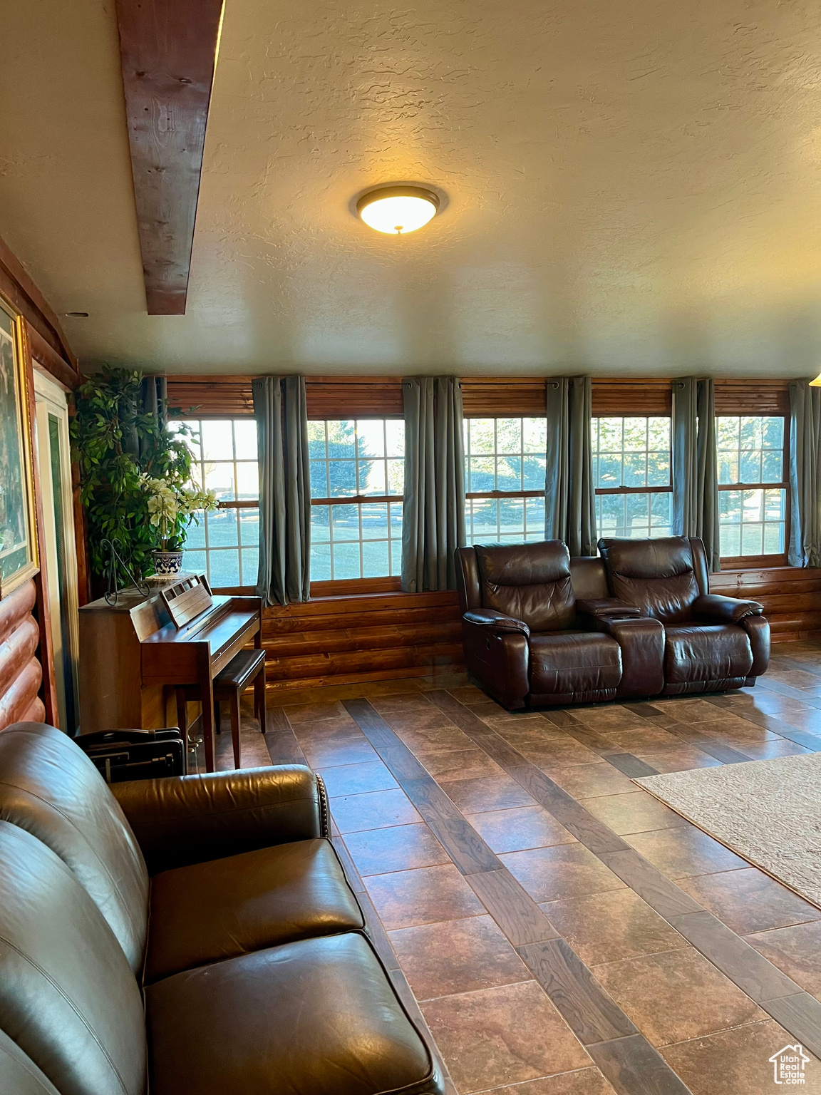 Large Living room with a view of the landscaping surrounding the home