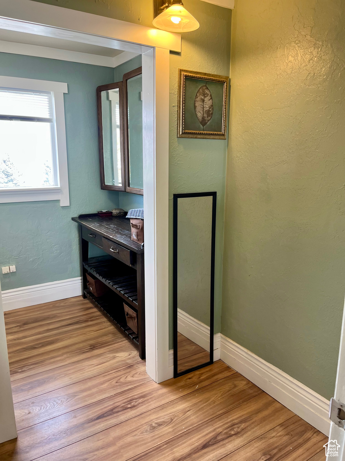 Hallway with light wood-type flooring