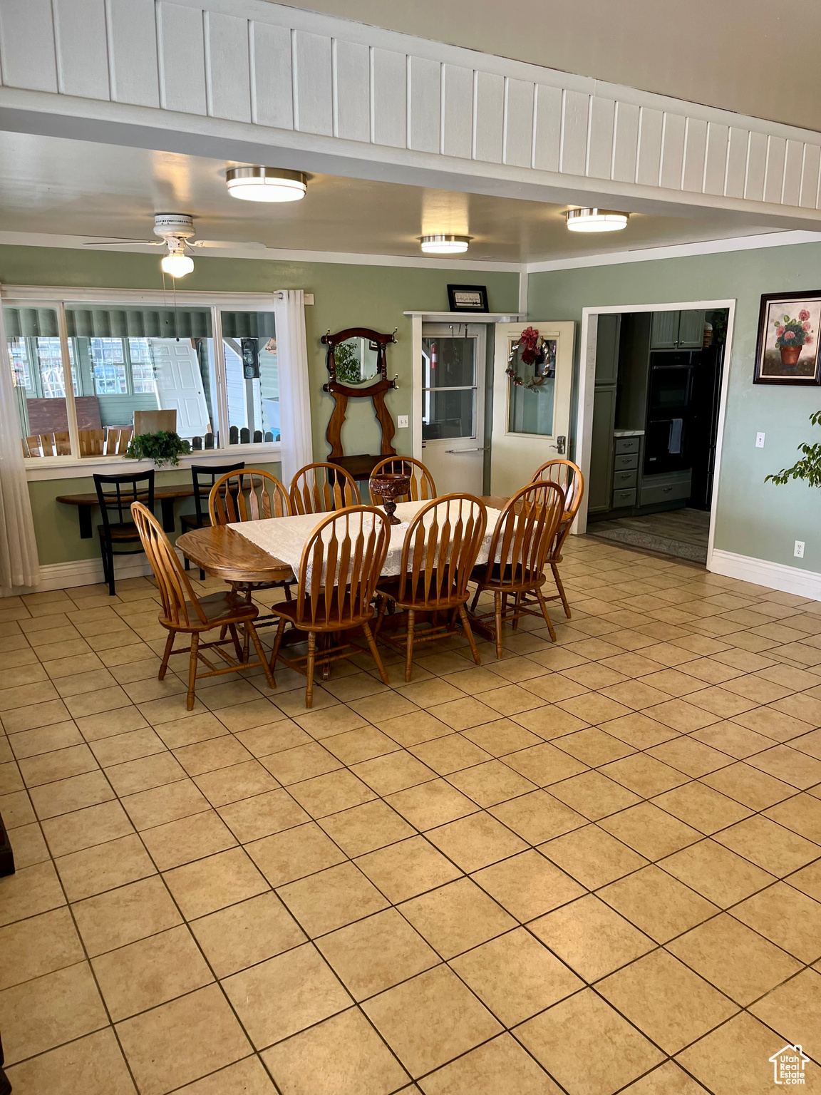 Tiled dining area with crown molding