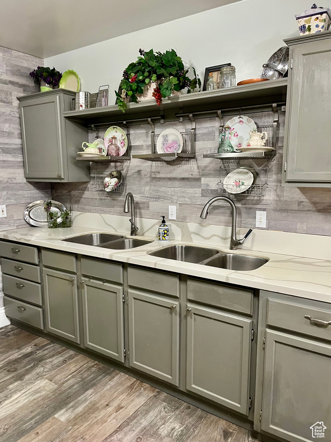 Kitchen featuring tasteful backsplash, sink, and hardwood / wood-style floors