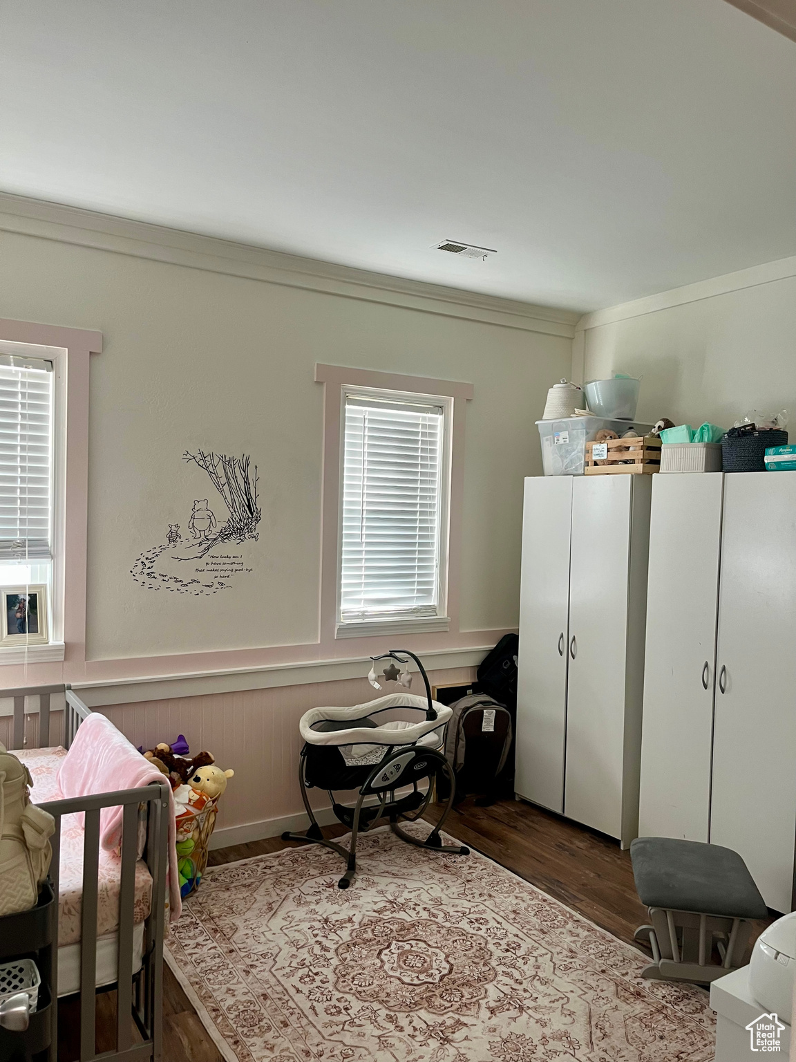 Bedroom with crown molding and dark hardwood / wood-style flooring