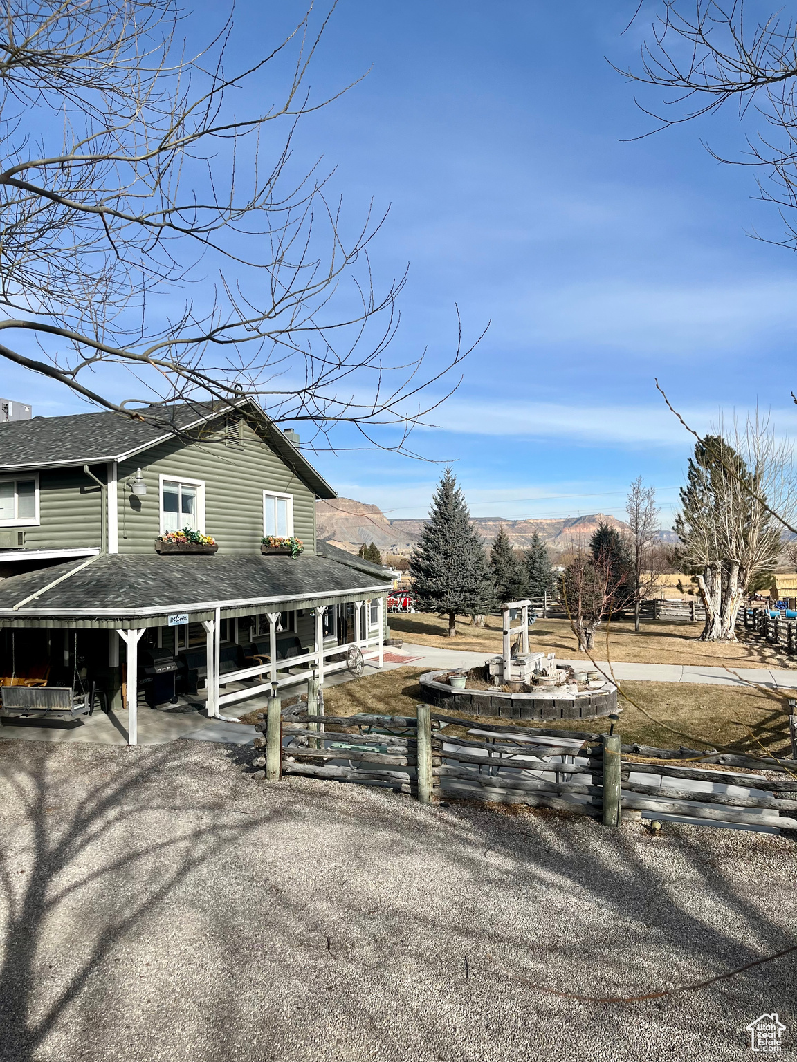 View of side of home with a mountain view