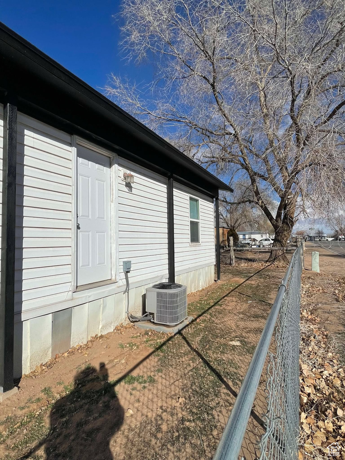 View of home's exterior featuring cooling unit