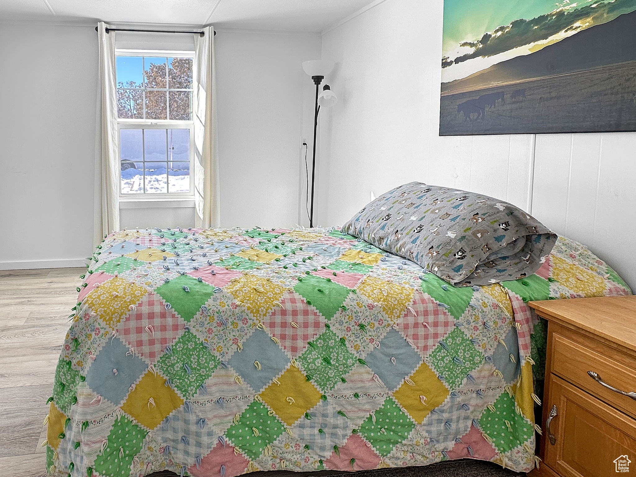Bedroom with light hardwood / wood-style flooring