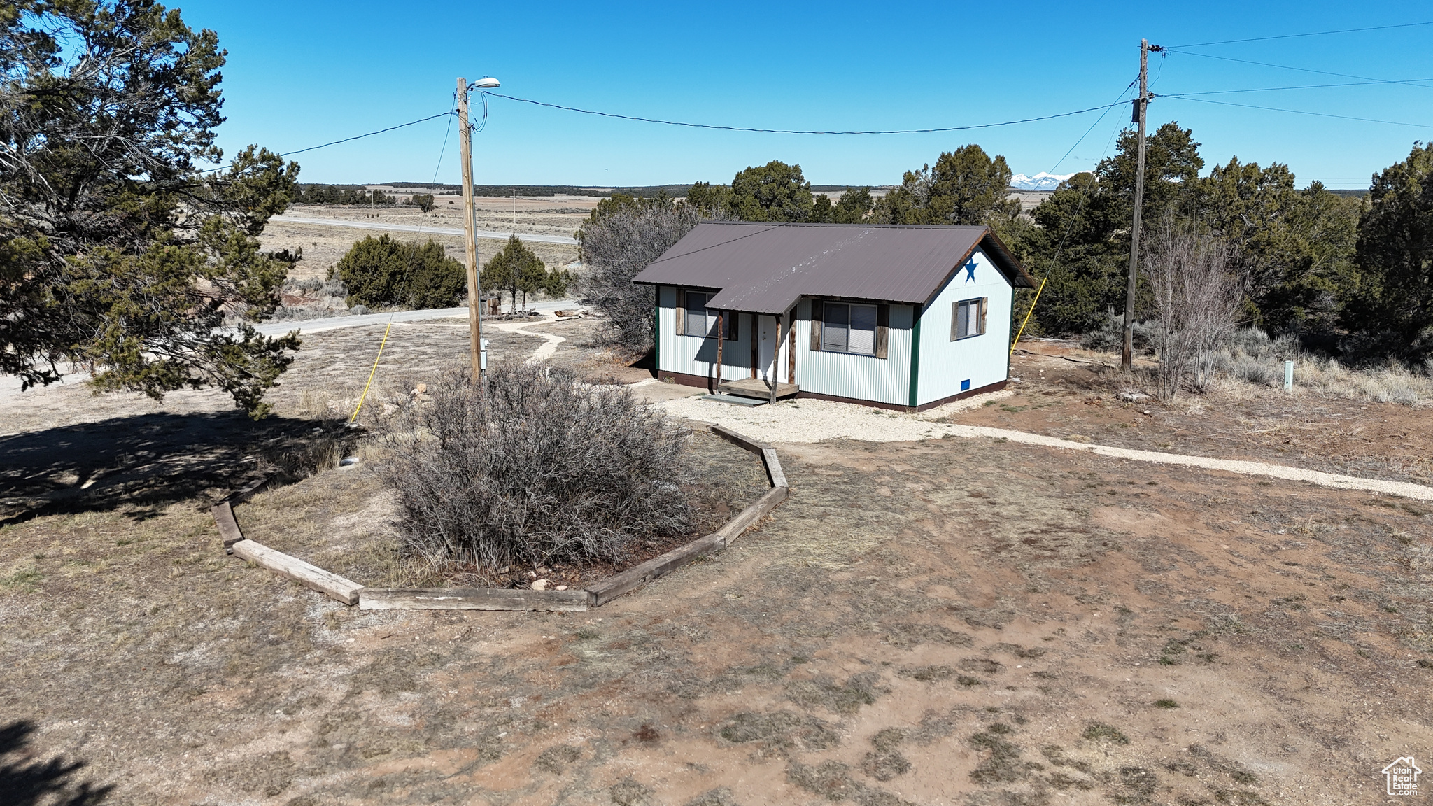 View of front of home featuring metal roof