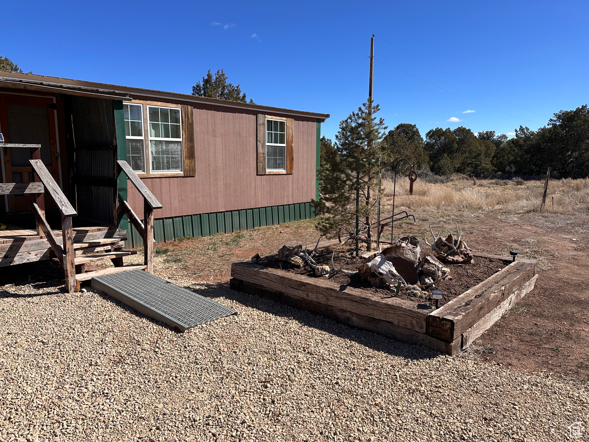 View of home's exterior with entry steps
