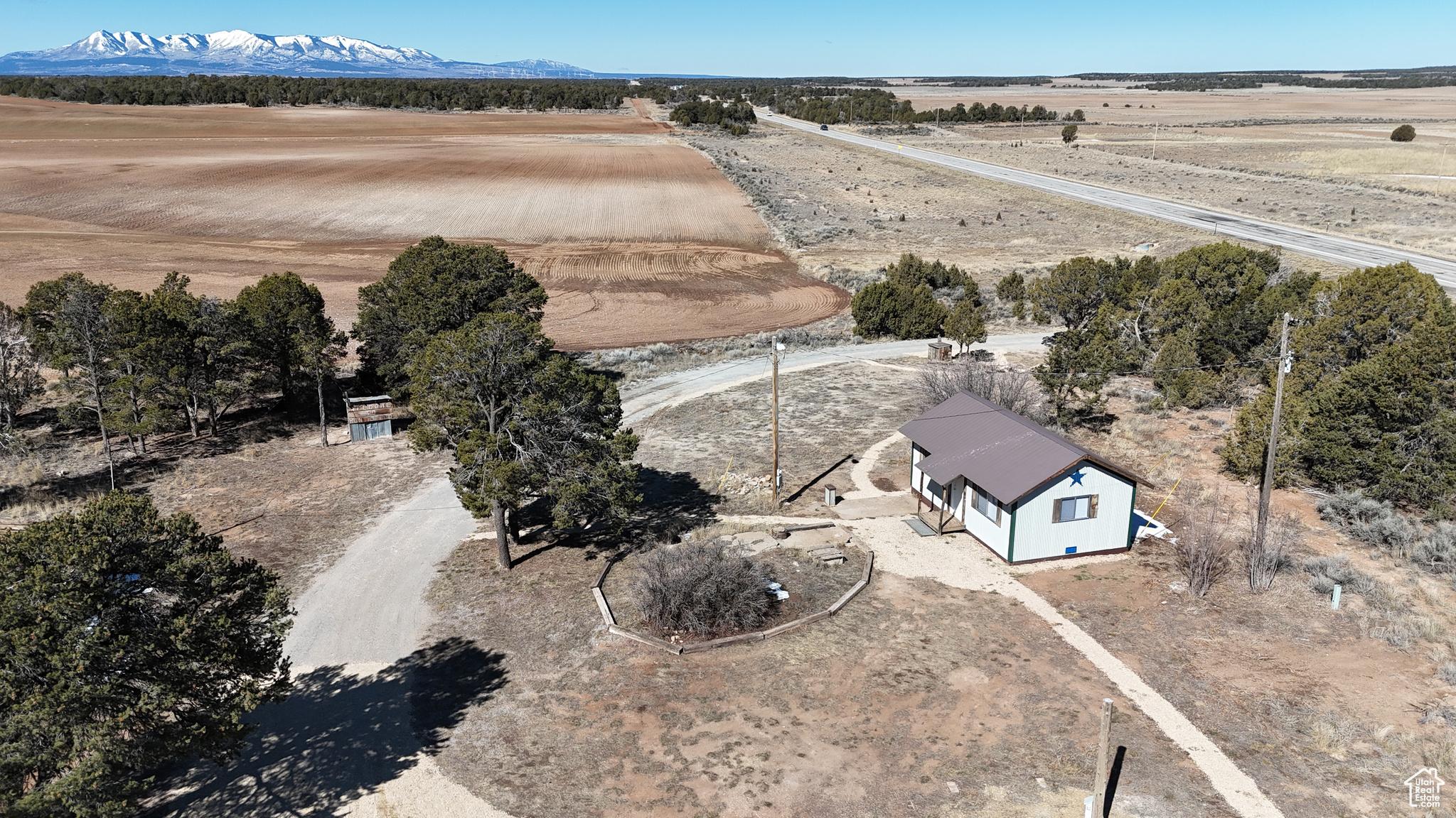 Birds eye view of property with a mountain view and a rural view