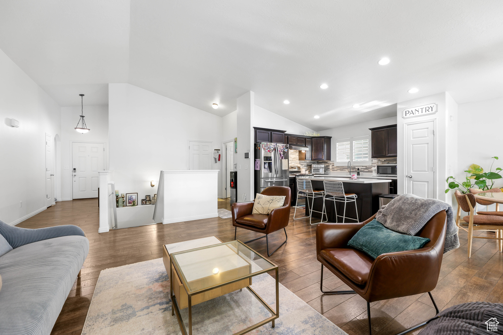 Living room featuring hardwood / wood-style floors and high vaulted ceiling