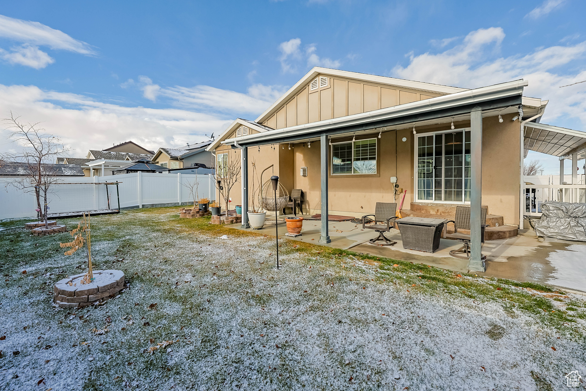 Rear view of house featuring a patio