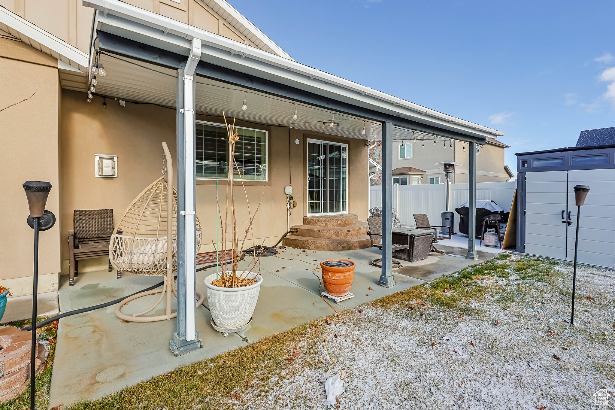 Back of house with a patio