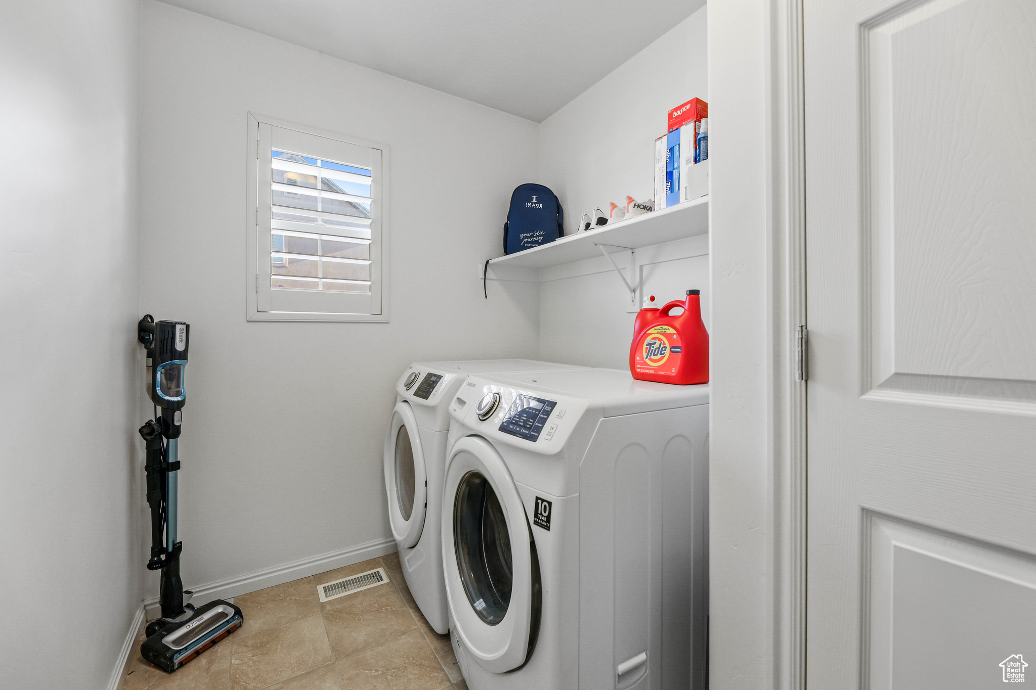 Laundry area with washer and clothes dryer