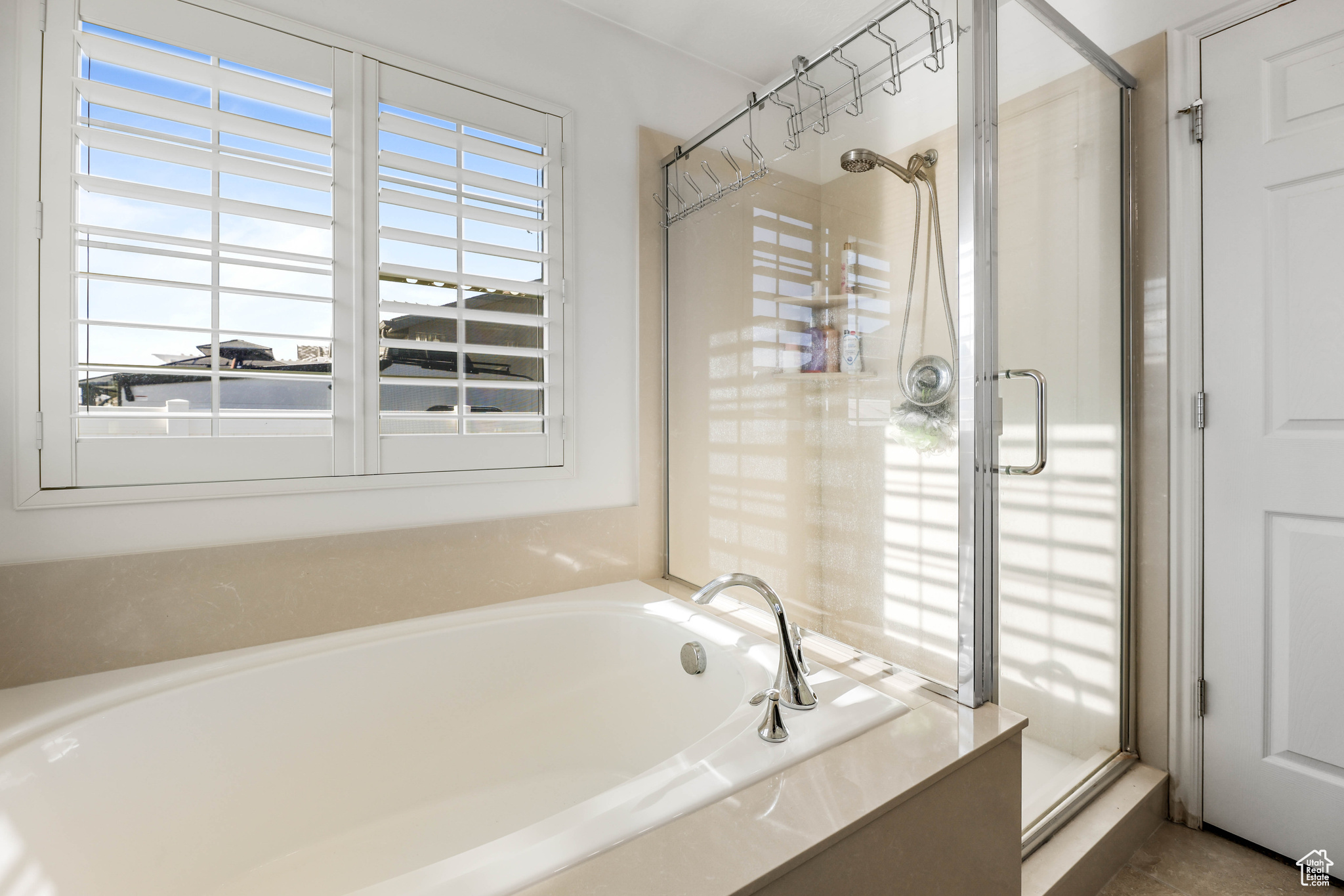 Bathroom featuring separate shower and tub