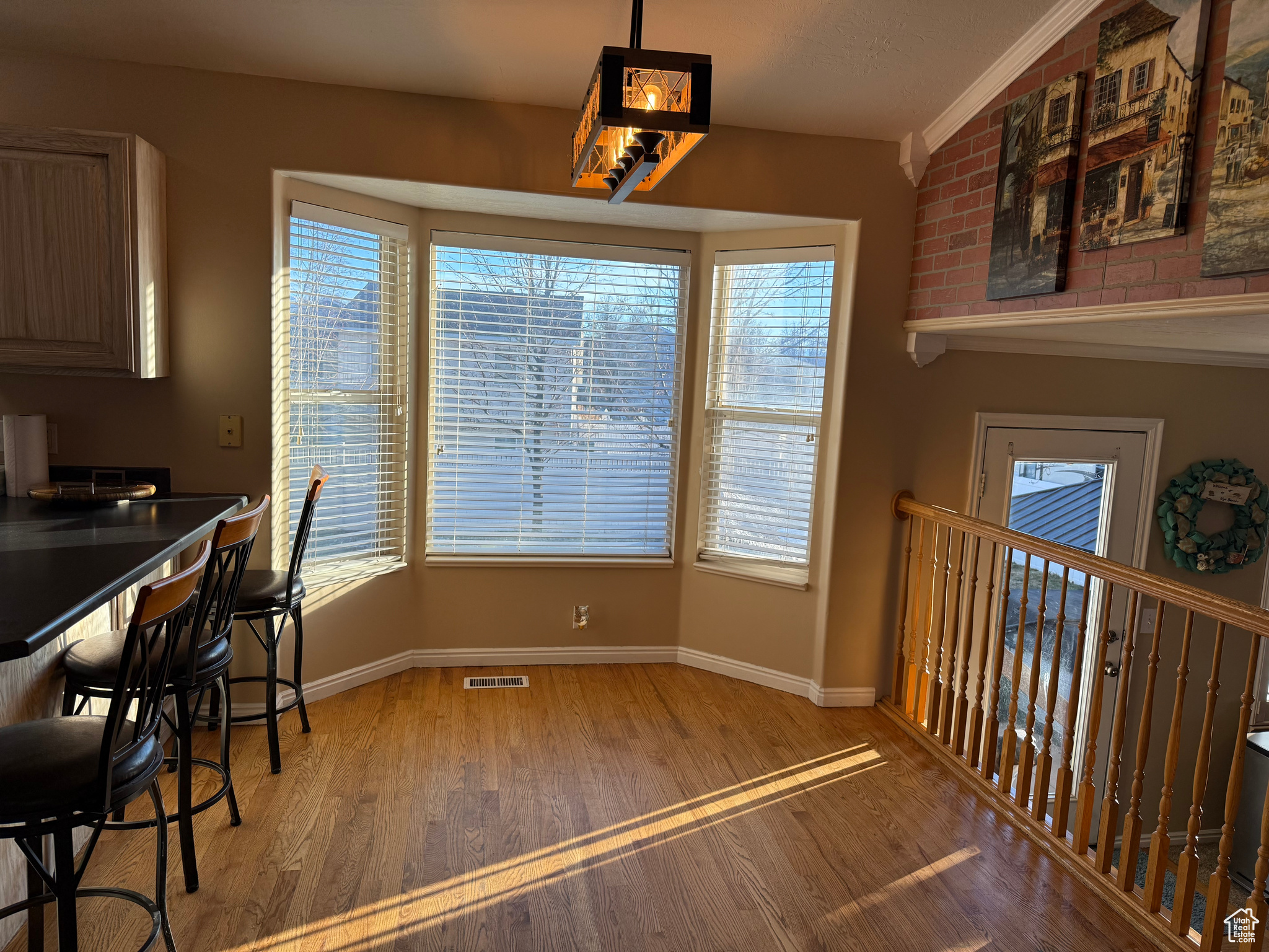 Dining area with hardwood flooring