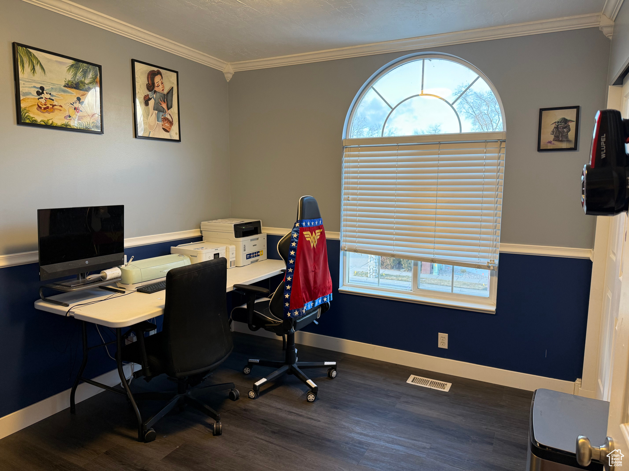 Office featuring dark wood-type flooring and ornamental molding