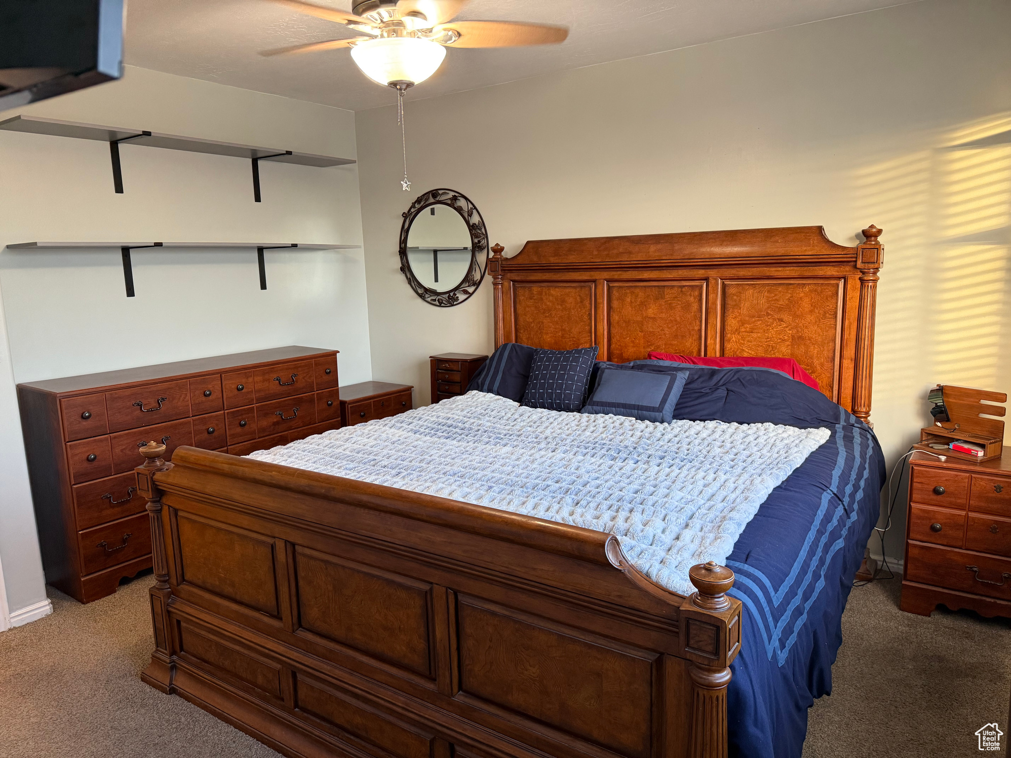 Bedroom featuring ceiling fan and carpet flooring