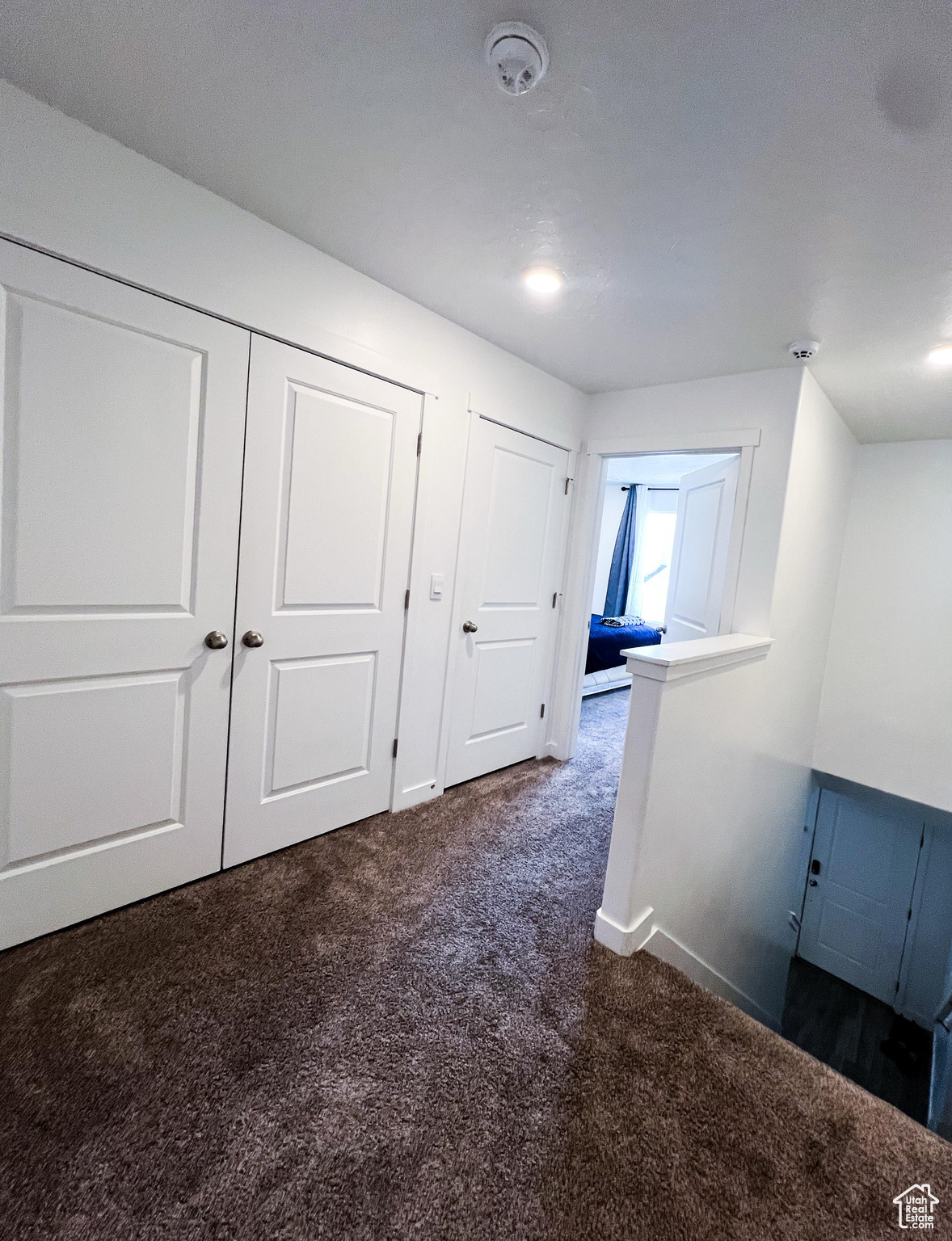 Hall with dark carpet