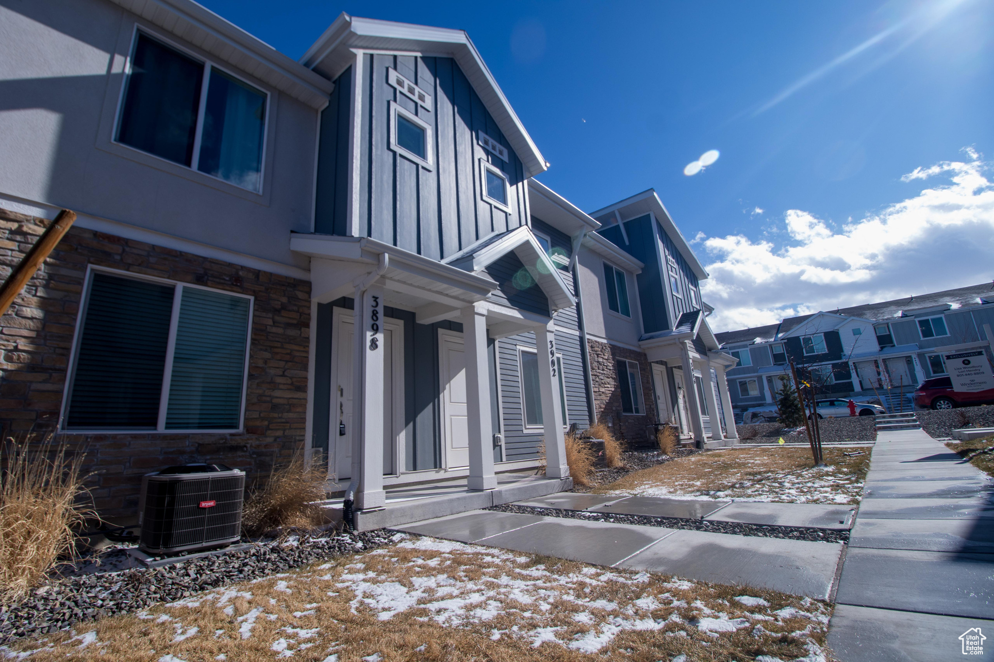 View of snowy exterior featuring central AC unit