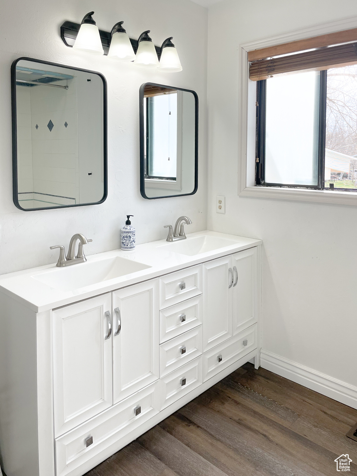 Bathroom with vanity and hardwood / wood-style floors