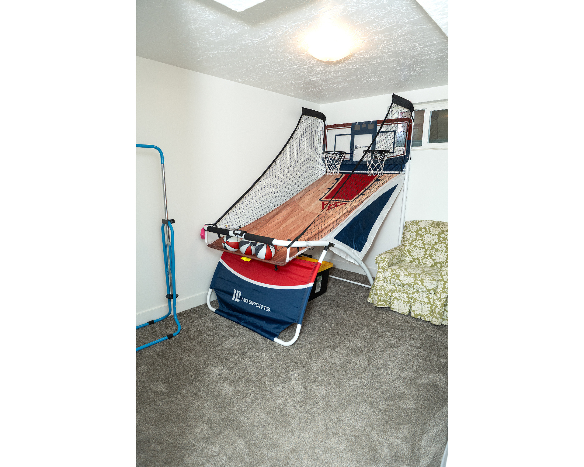 Bedroom featuring a textured ceiling and carpet