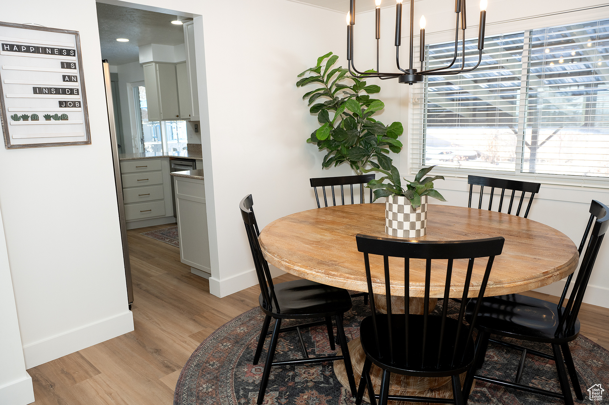 Dining area with a chandelier and light wood-type flooring