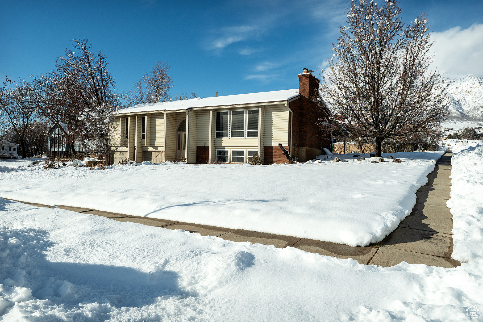 View of front of home featuring a chimney