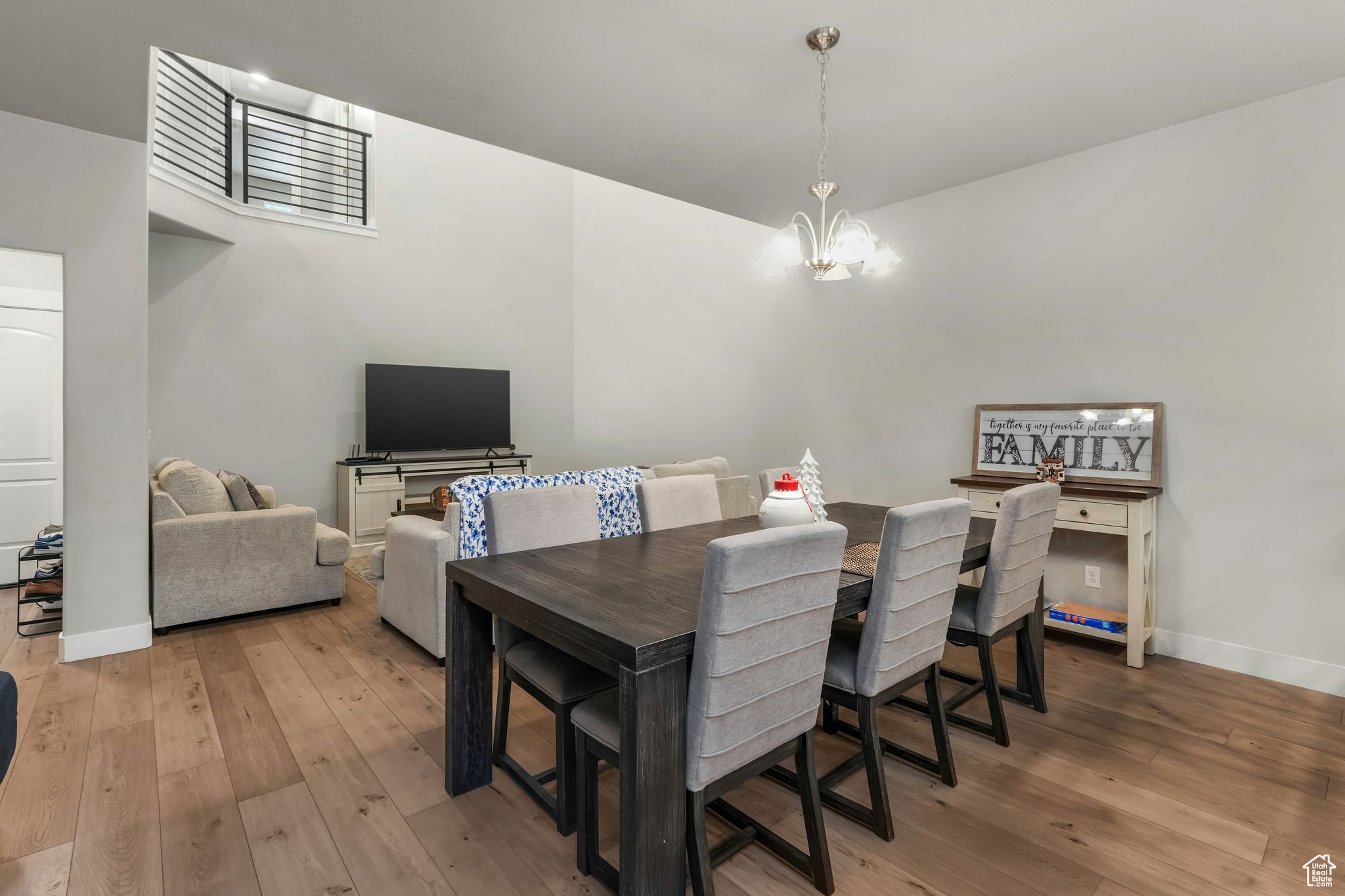 Dining space with an inviting chandelier and light wood-type flooring