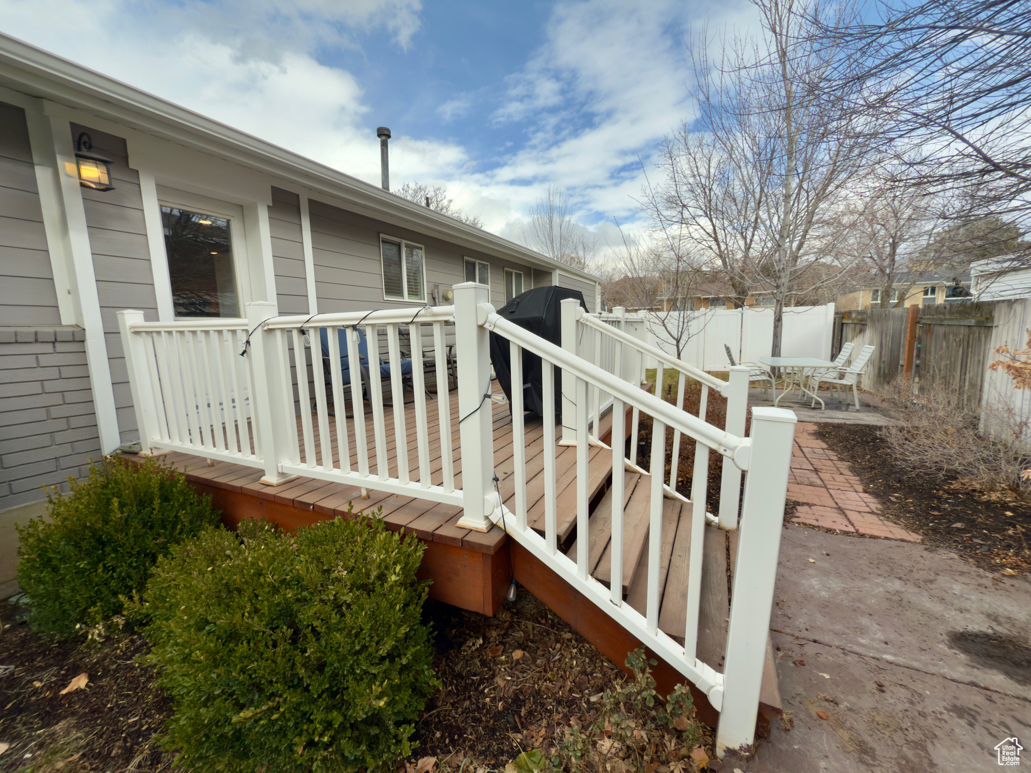 Wooden deck with a patio area