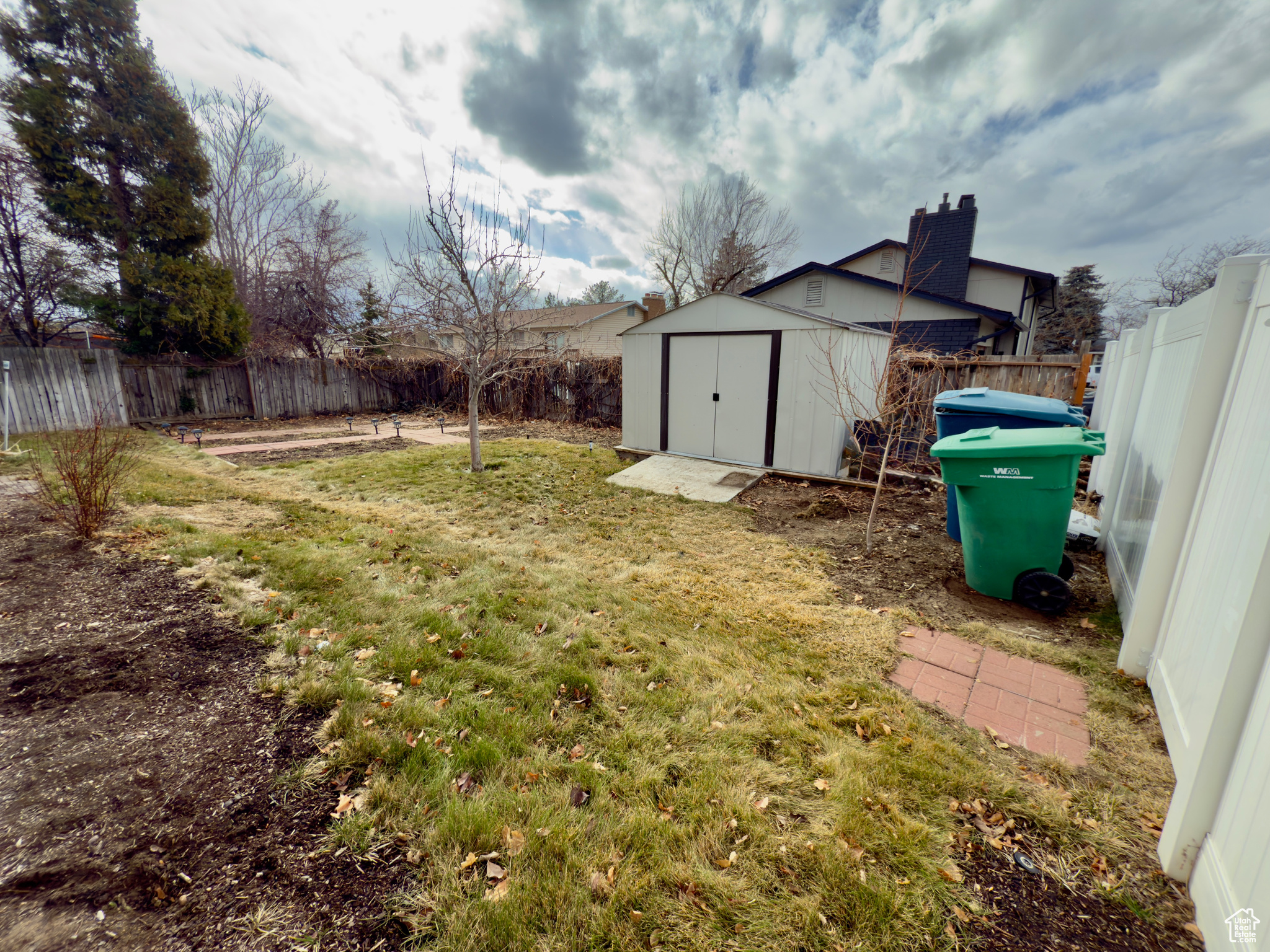 View of side yard and shed